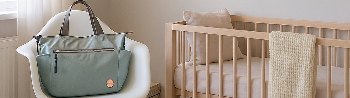 image of tillie tote bag in slate/teal on chair in baby's nursery