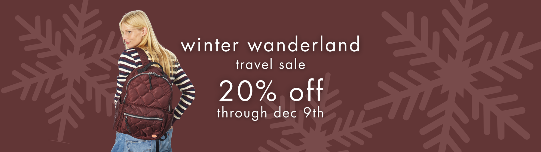 wintery image with model in stripe shirt wearing a tate backpack in bordeaux. the image announces 20% off travel bag sale.