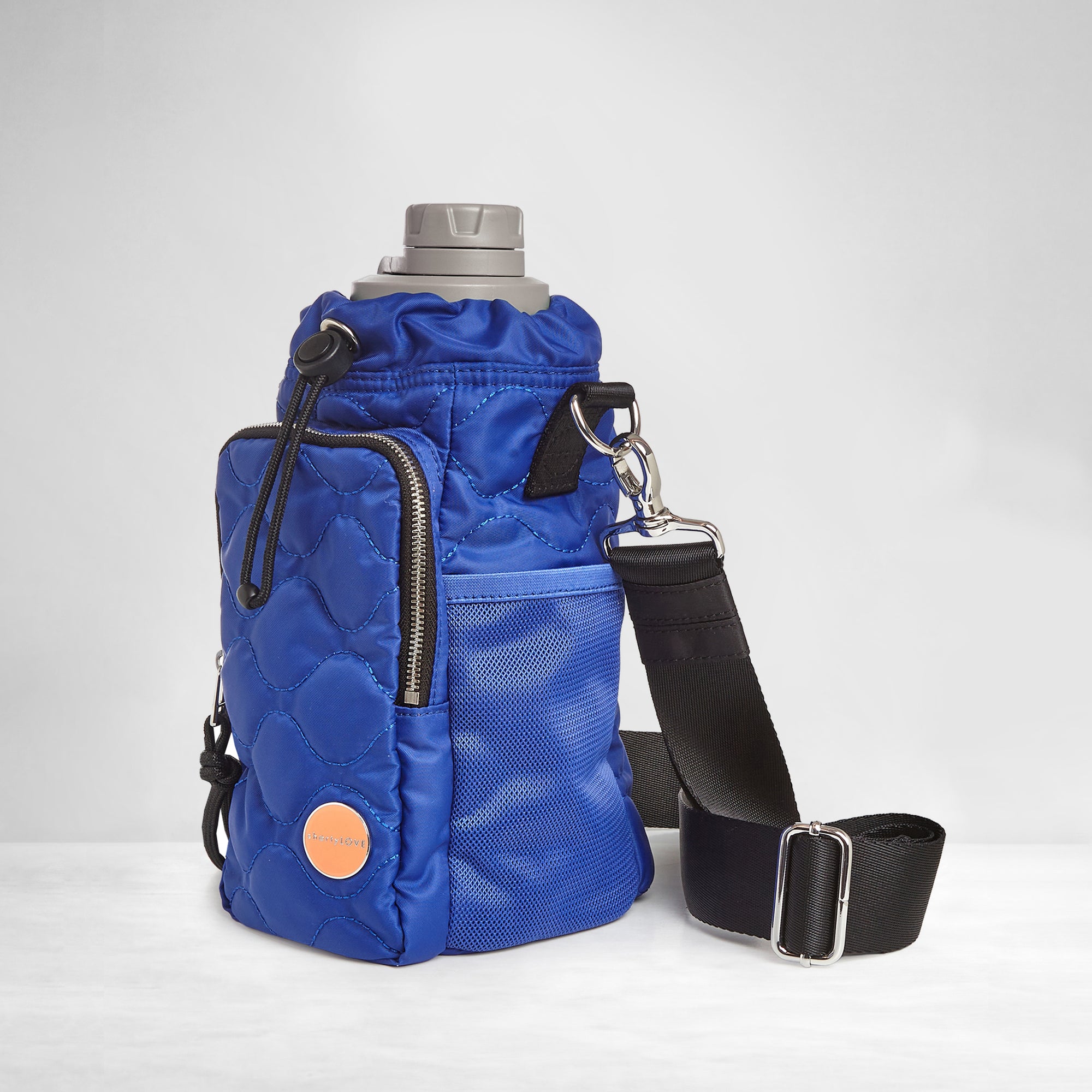 shortyLOVE bea sling bag in electric blue; side view against grey background
