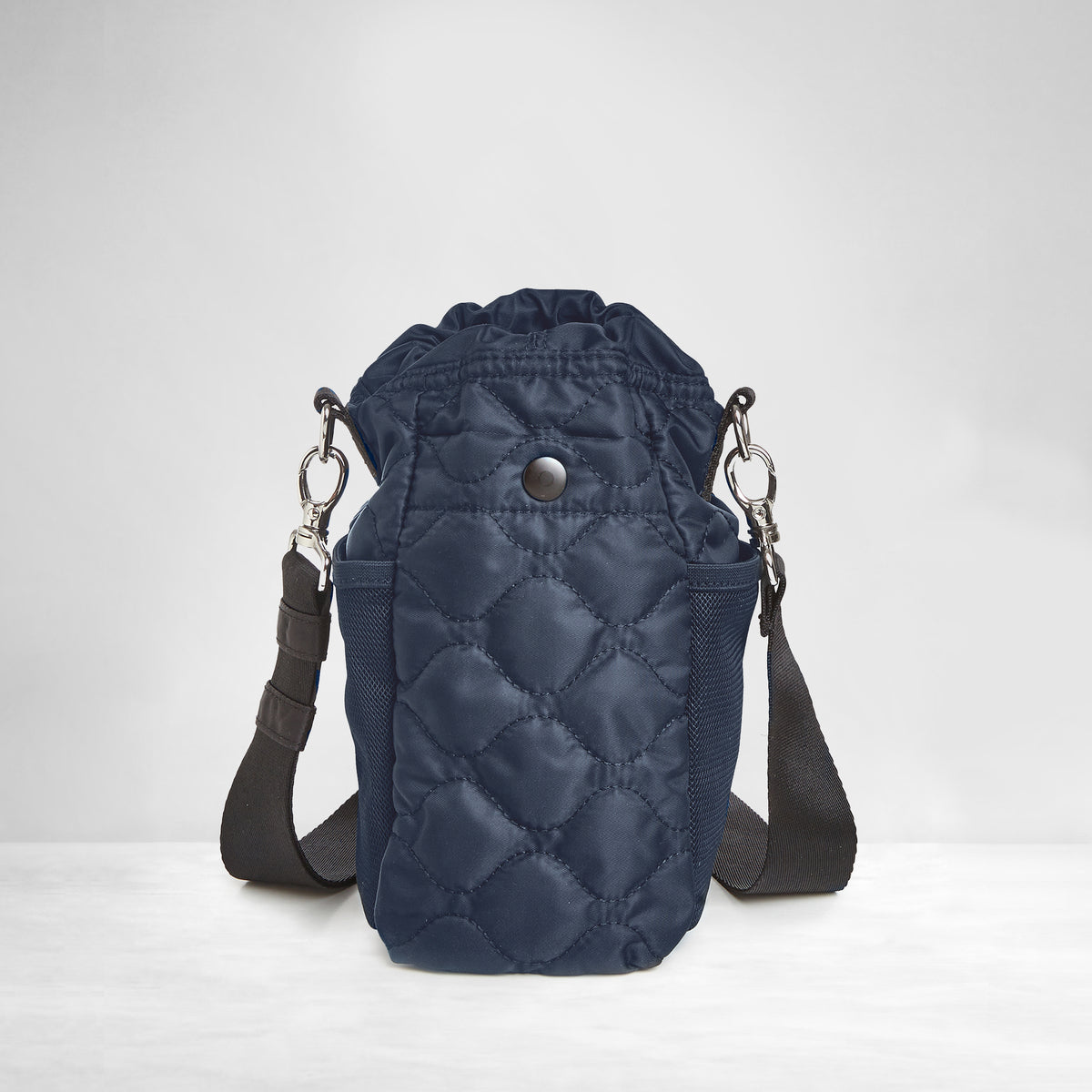 shortyLOVE bea sling bag in midnight; back view against grey background.