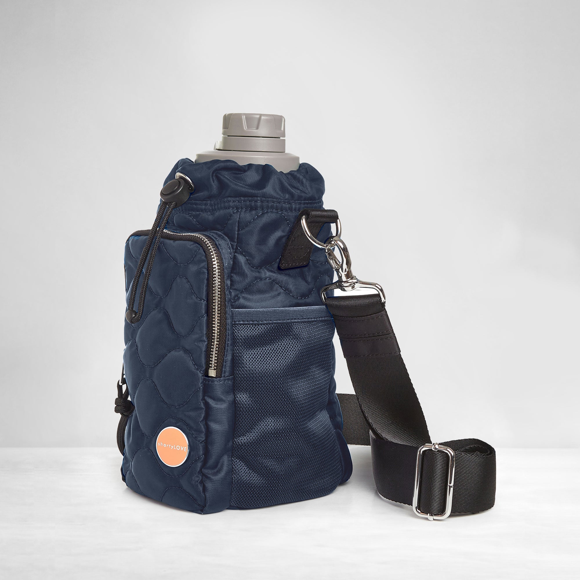shortyLOVE bea sling bag in midnight; side view against grey background.