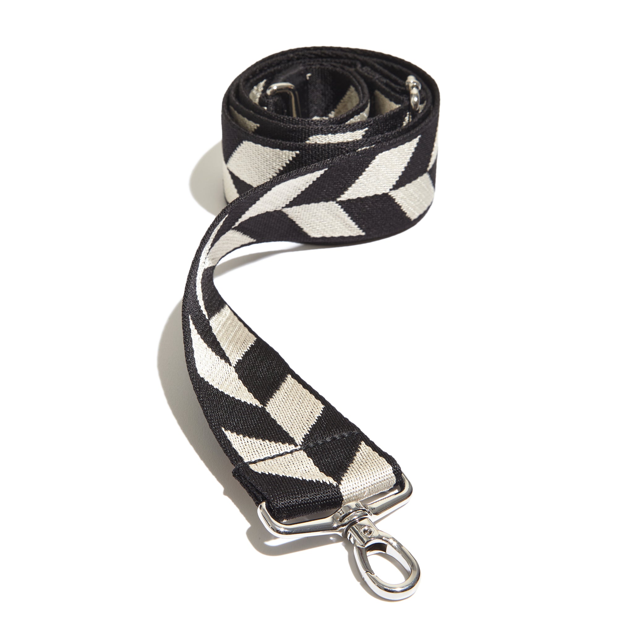 shortyLOVE boardwalk strap in the arrow design in black/cream; front view rolled against white background.