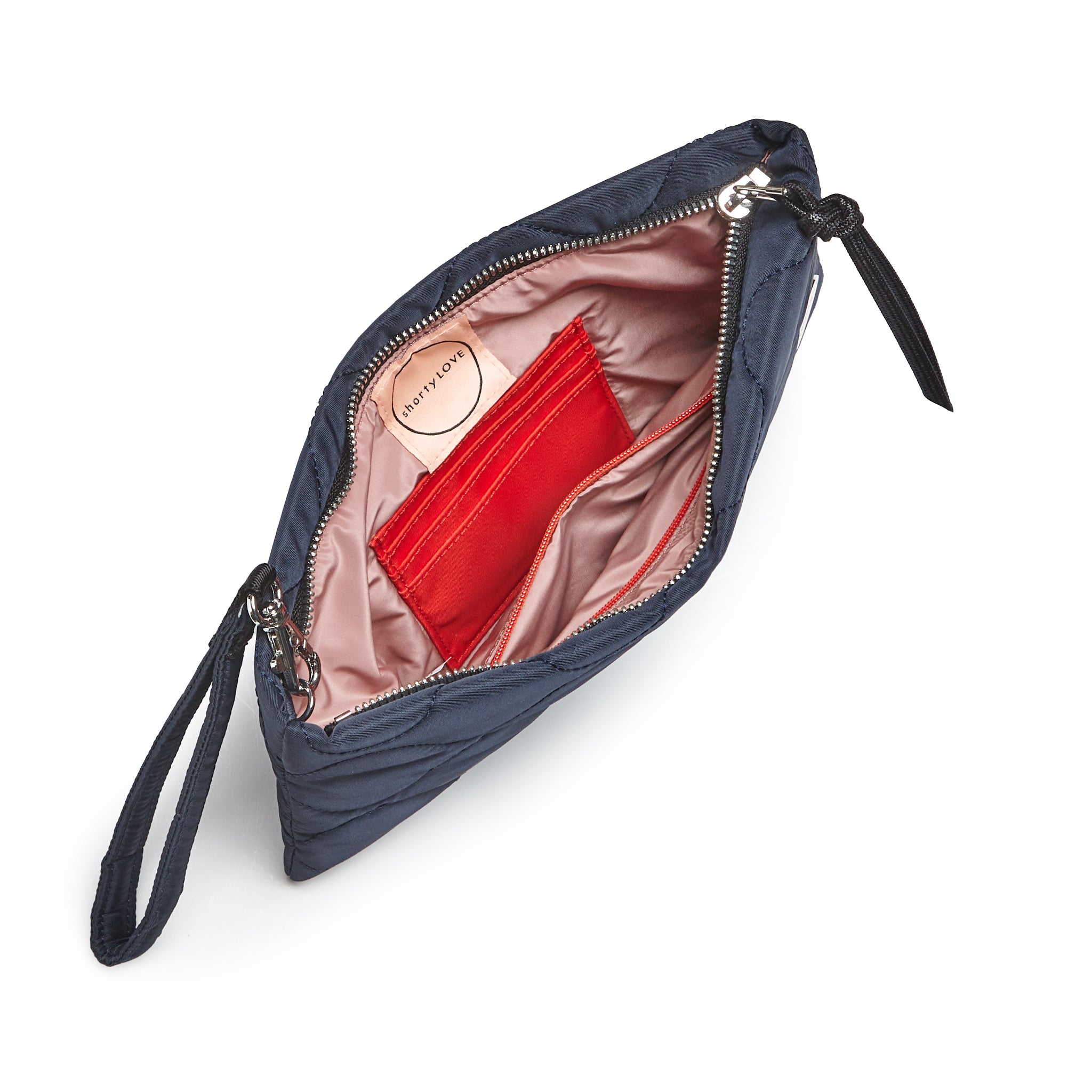 shortyLOVE cleo wristlet clutch in midnight; top-down view showing interior blush lining against white background.