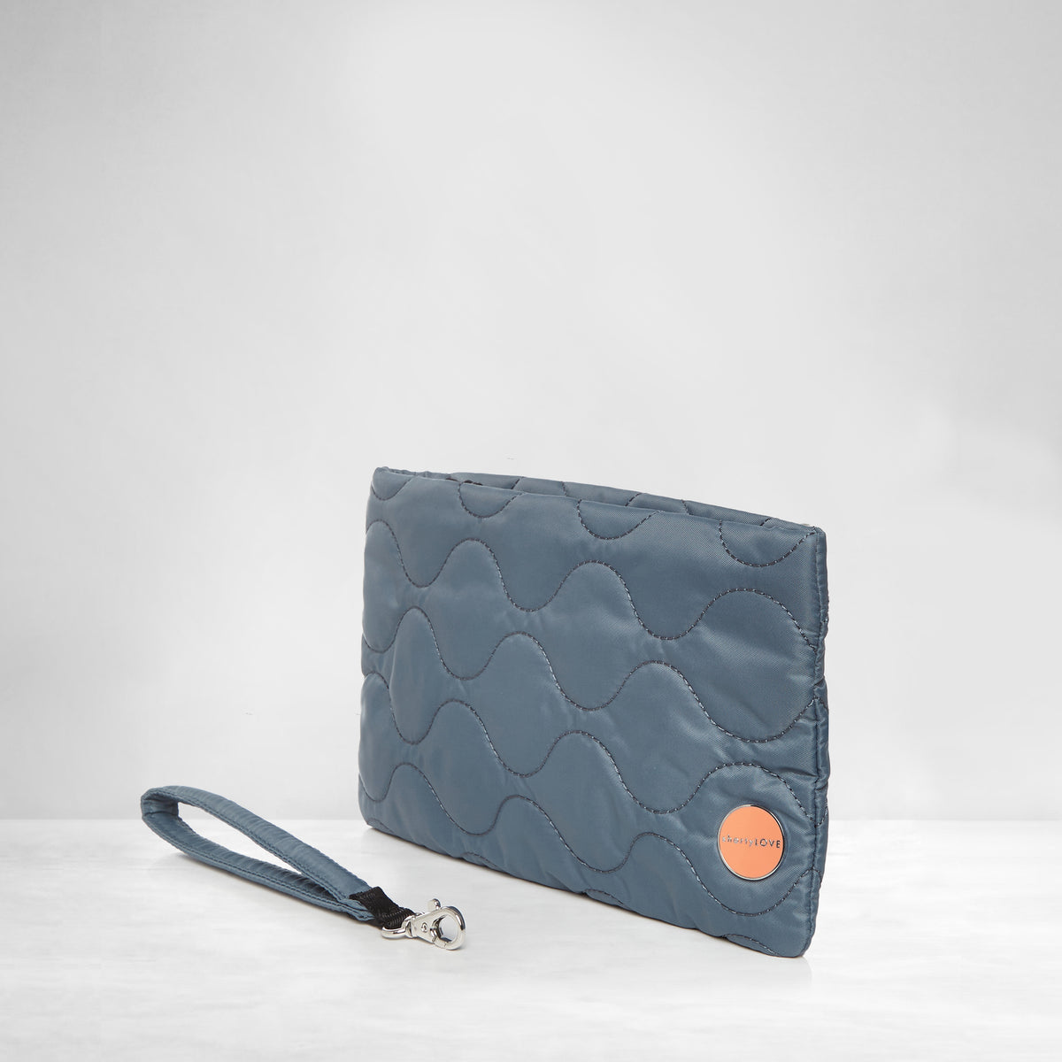 shortyLOVE cleo wristlet clutch in steel blue; side view against white background.
