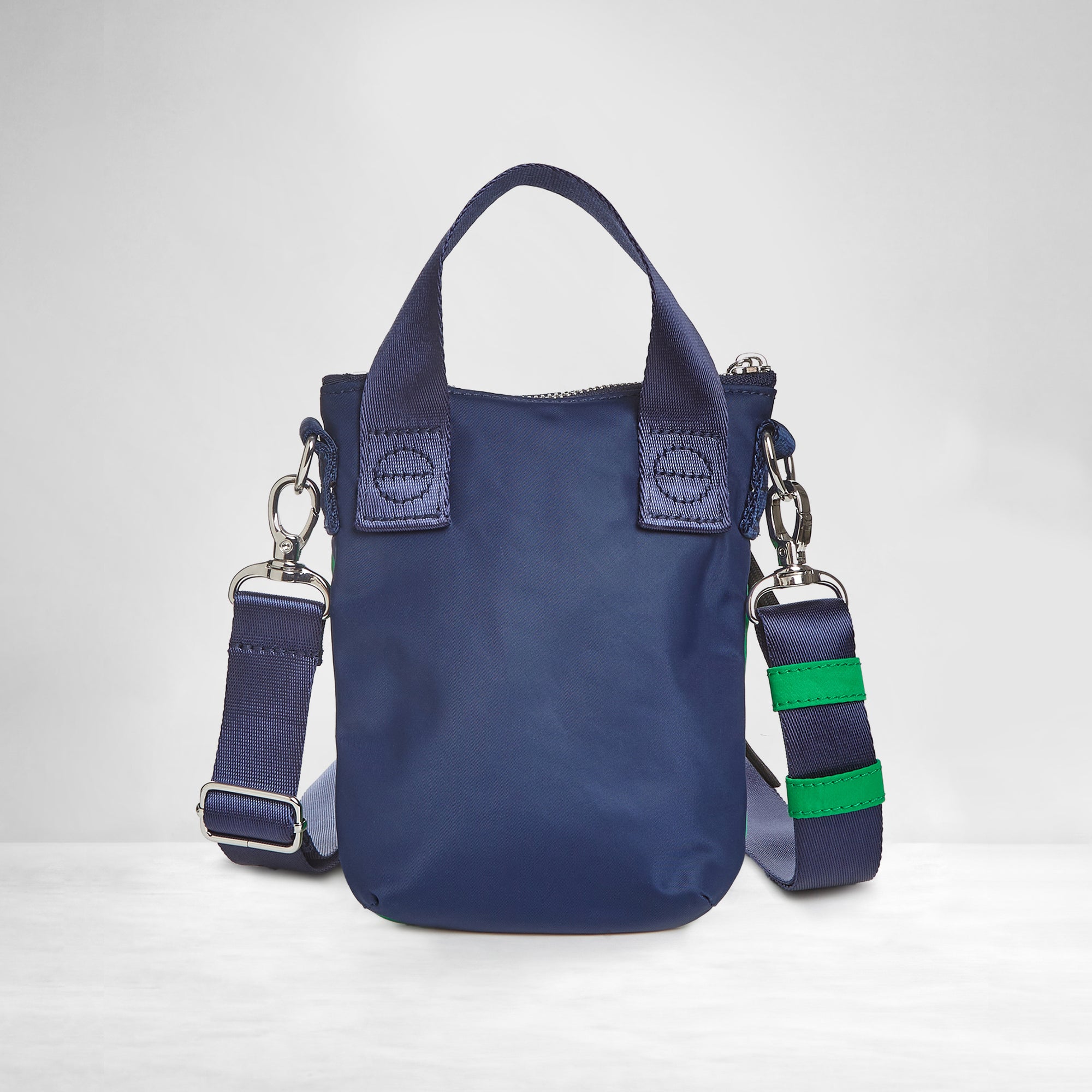 shortyLOVE shorthand small crossbody bag in grass green/navy; back view against white background.