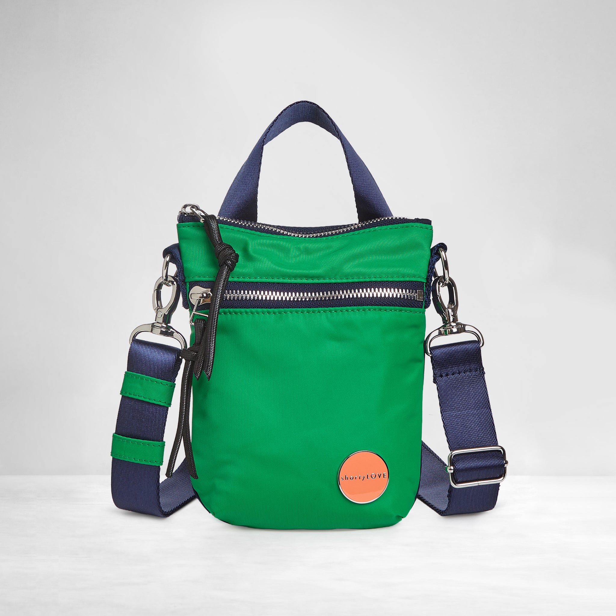 shortyLOVE shorthand small crossbody bag in grass green/navy; front view against white background.