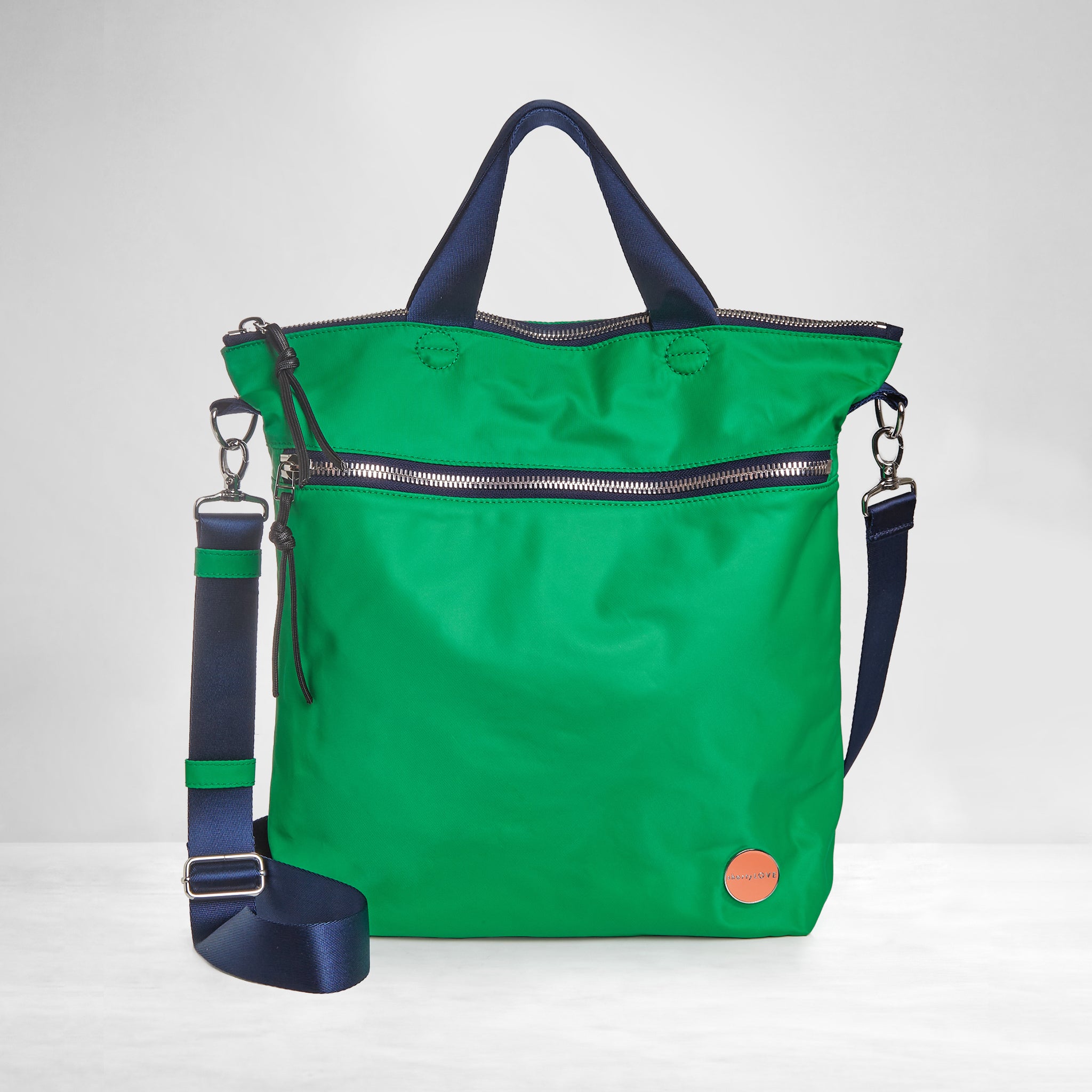 shortyLOVE wonder large crossbody/messenger bag in grass green/navy; front view against white background.