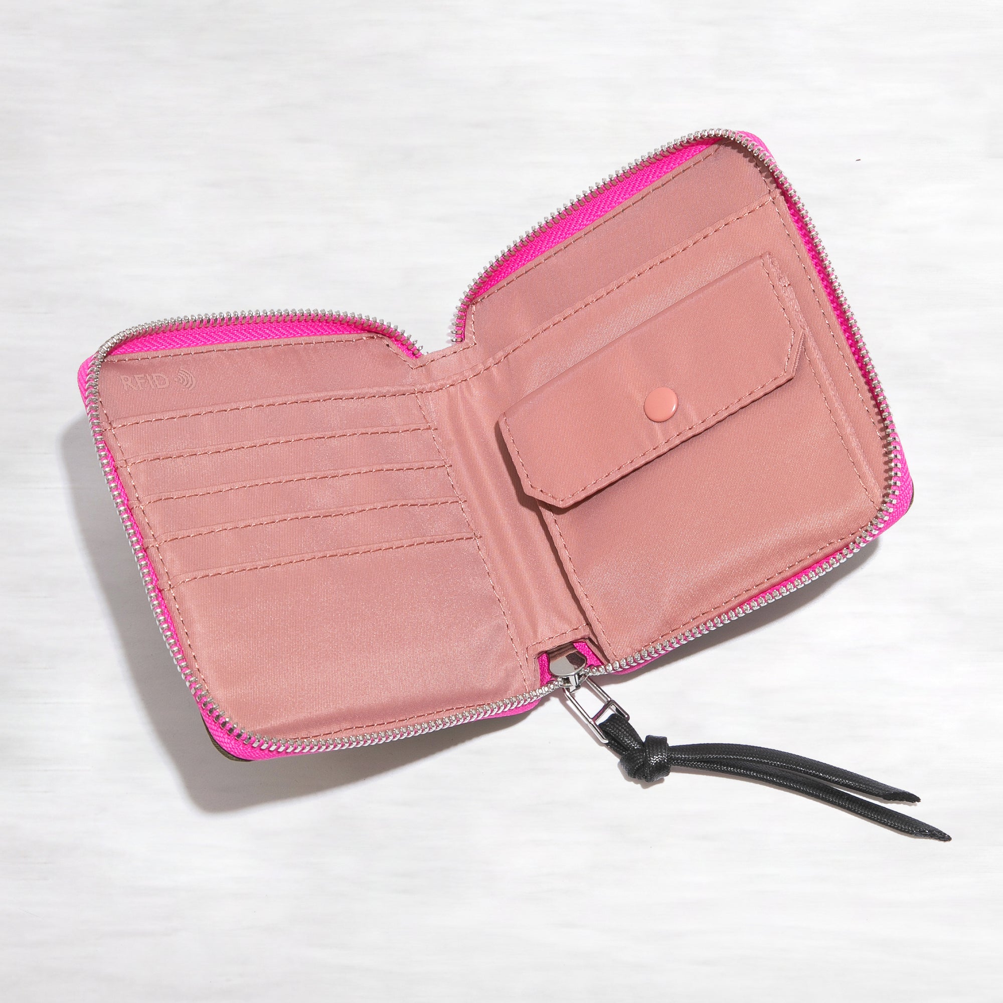 shortyLOVE merchant small wallet in army green; top-down view showing interior pink lining against white background.