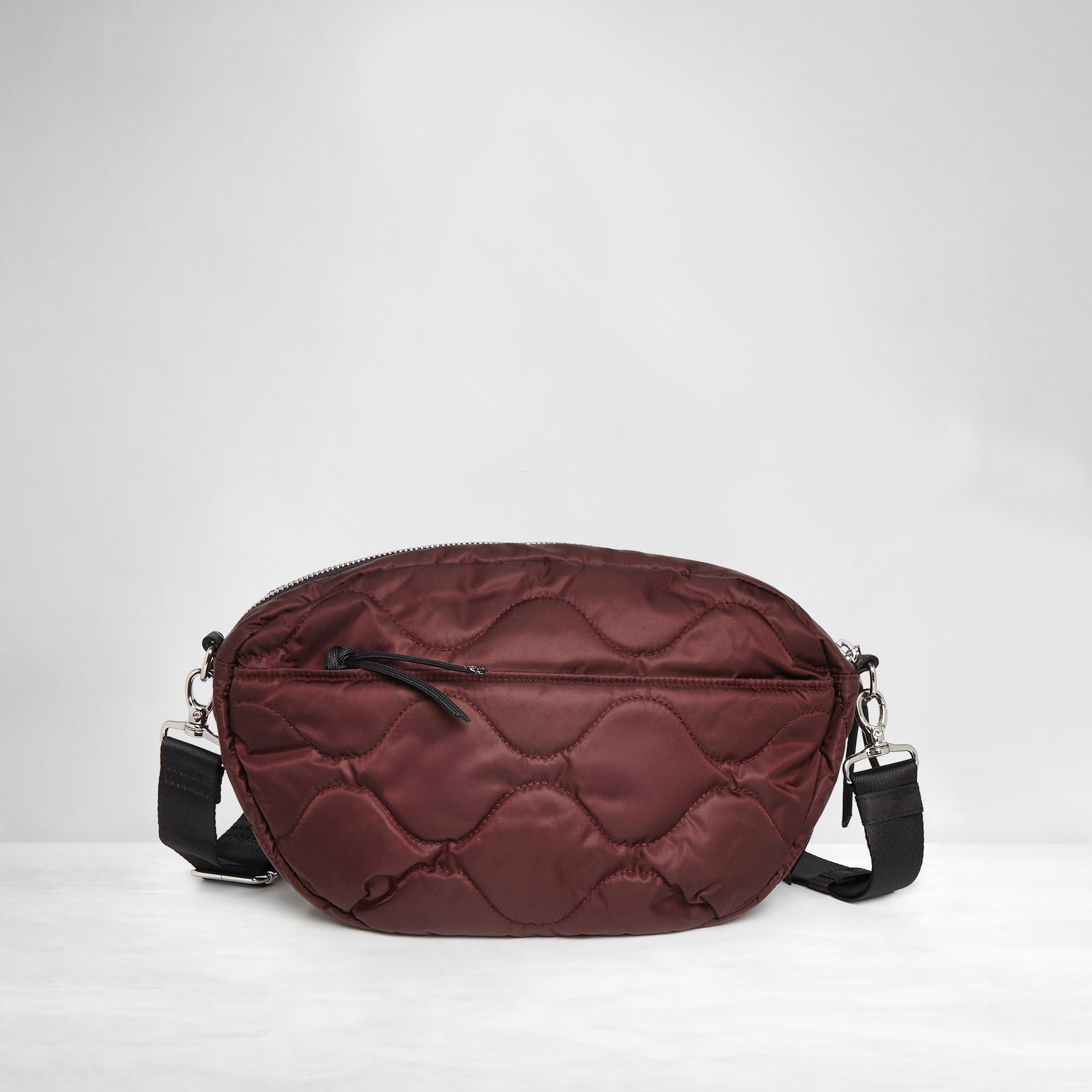 shortyLOVE cruiser medium crossbody bag in bordeaux; back view against white background.