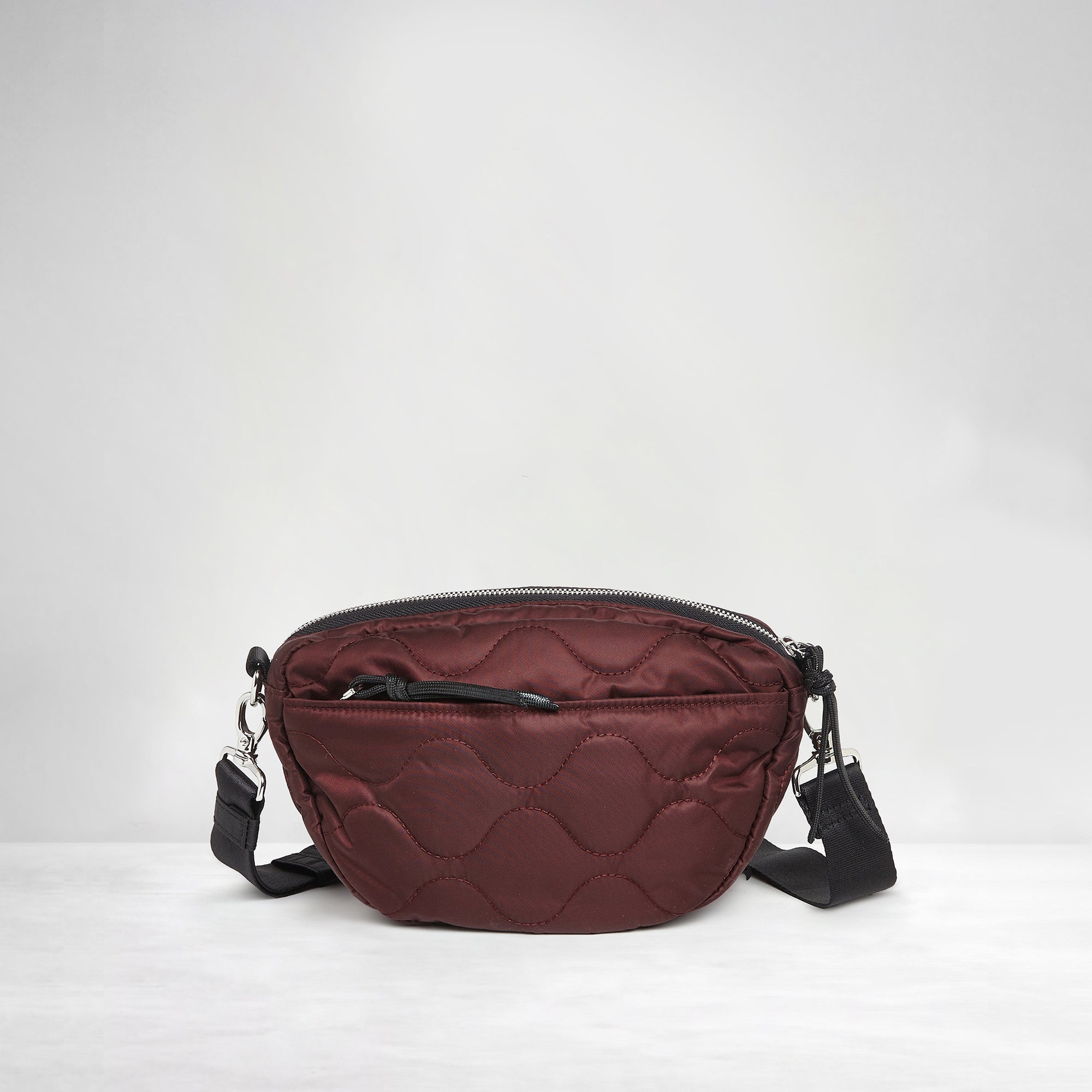 shortyLOVE small cruiser small crossbody bag in bordeaux; back view against white background.