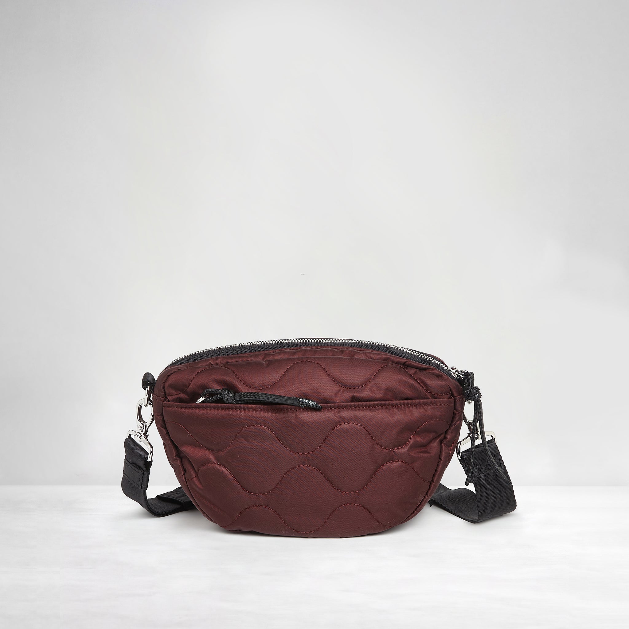 shortyLOVE small cruiser small crossbody bag in bordeaux; back view against white background.