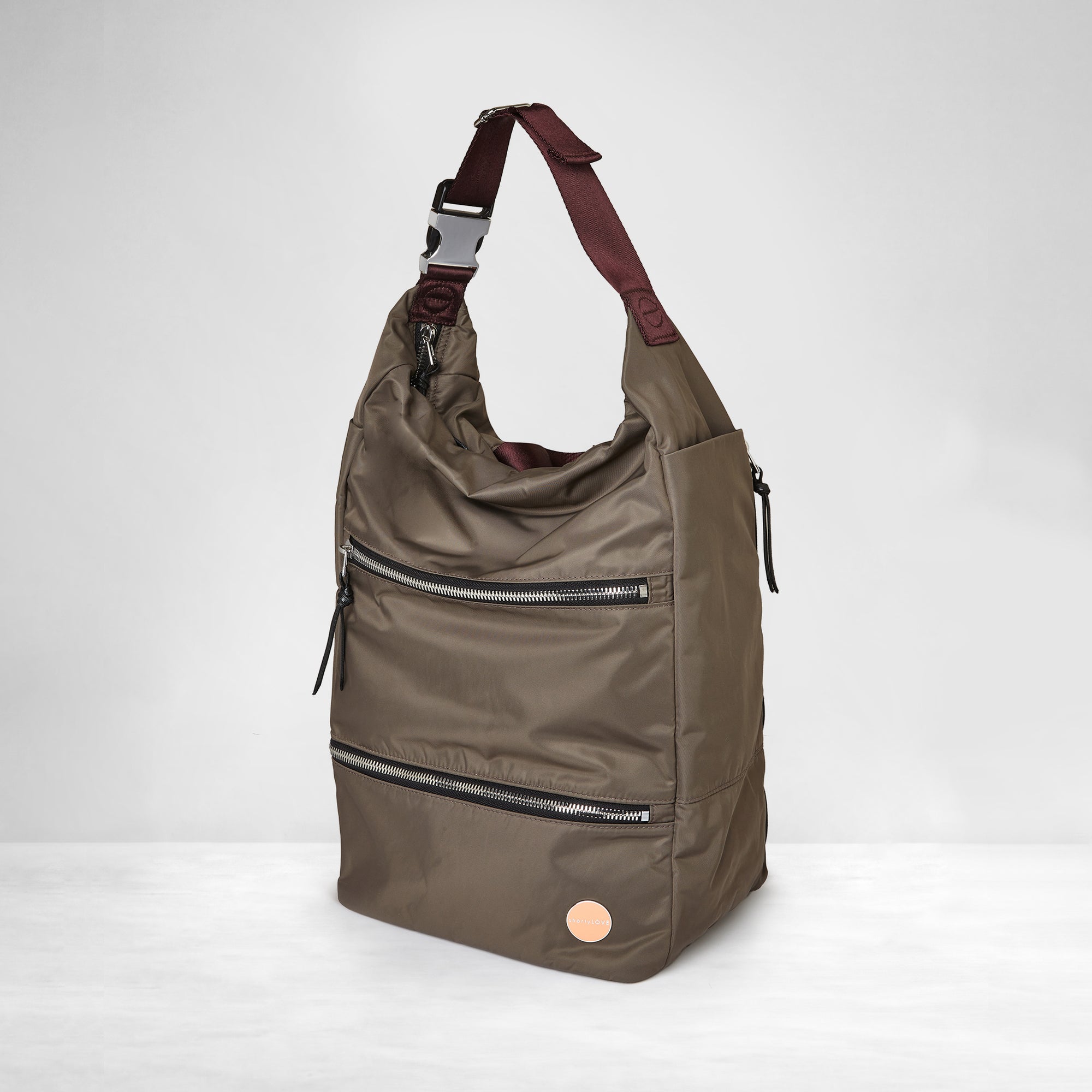 shortyLOVE boxer backpack in mocha; side angle view against white background.