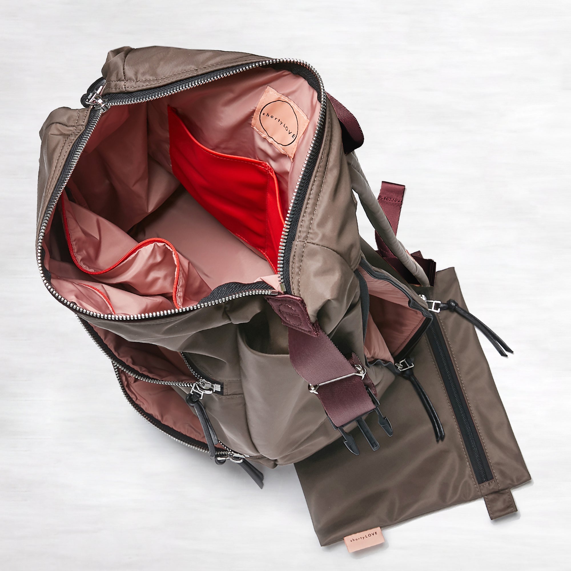 shortyLOVE boxer backpack in mocha; top-down view showing interior mocha lining against white background.