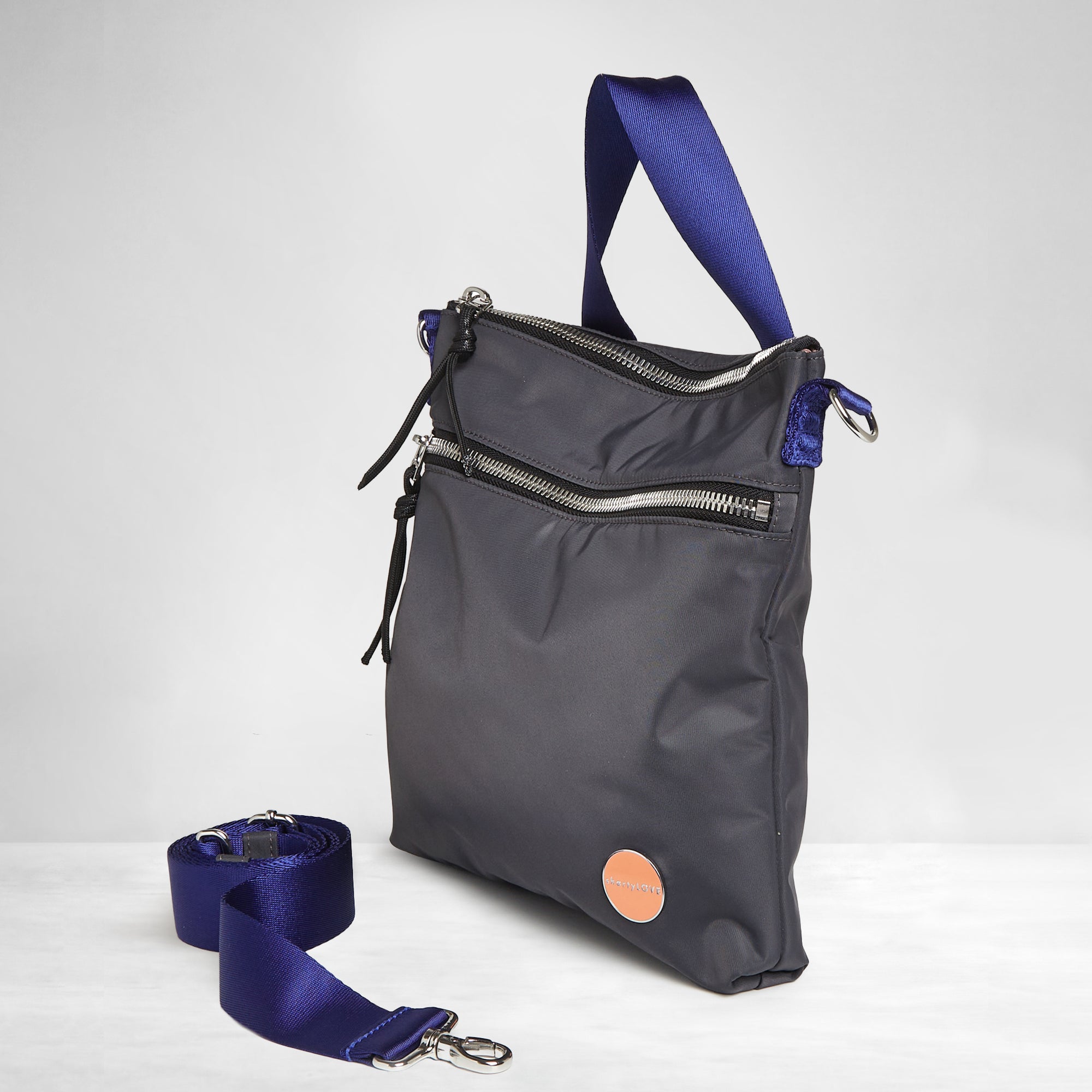 shortyLOVE amuse medium sized crossbody bag in charcoal; side angle view against white background.