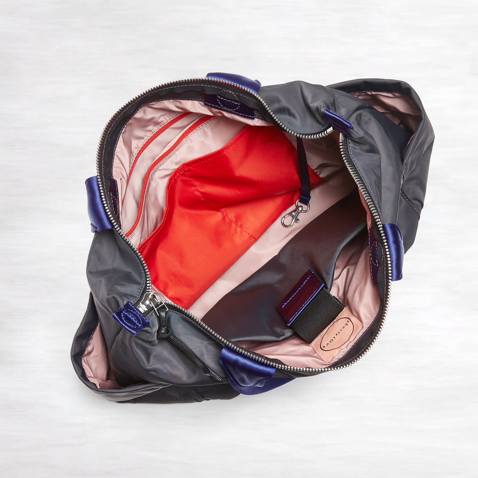 shortyLOVE tillie tote bag in charcoal; top-down view showing interior blush/red lining against white background.