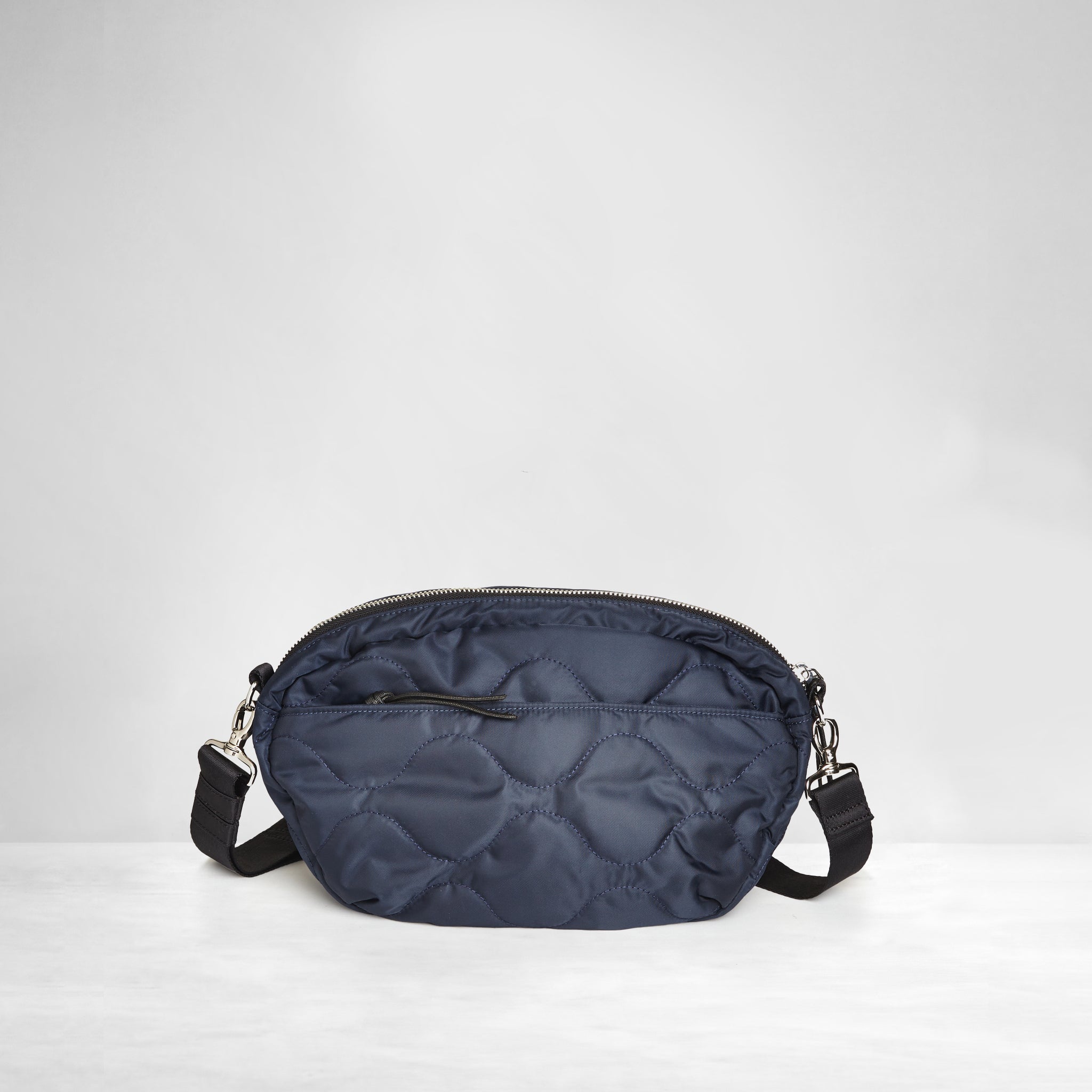 shortyLOVE cruiser medium crossbody bag in midnight; back view against white background.