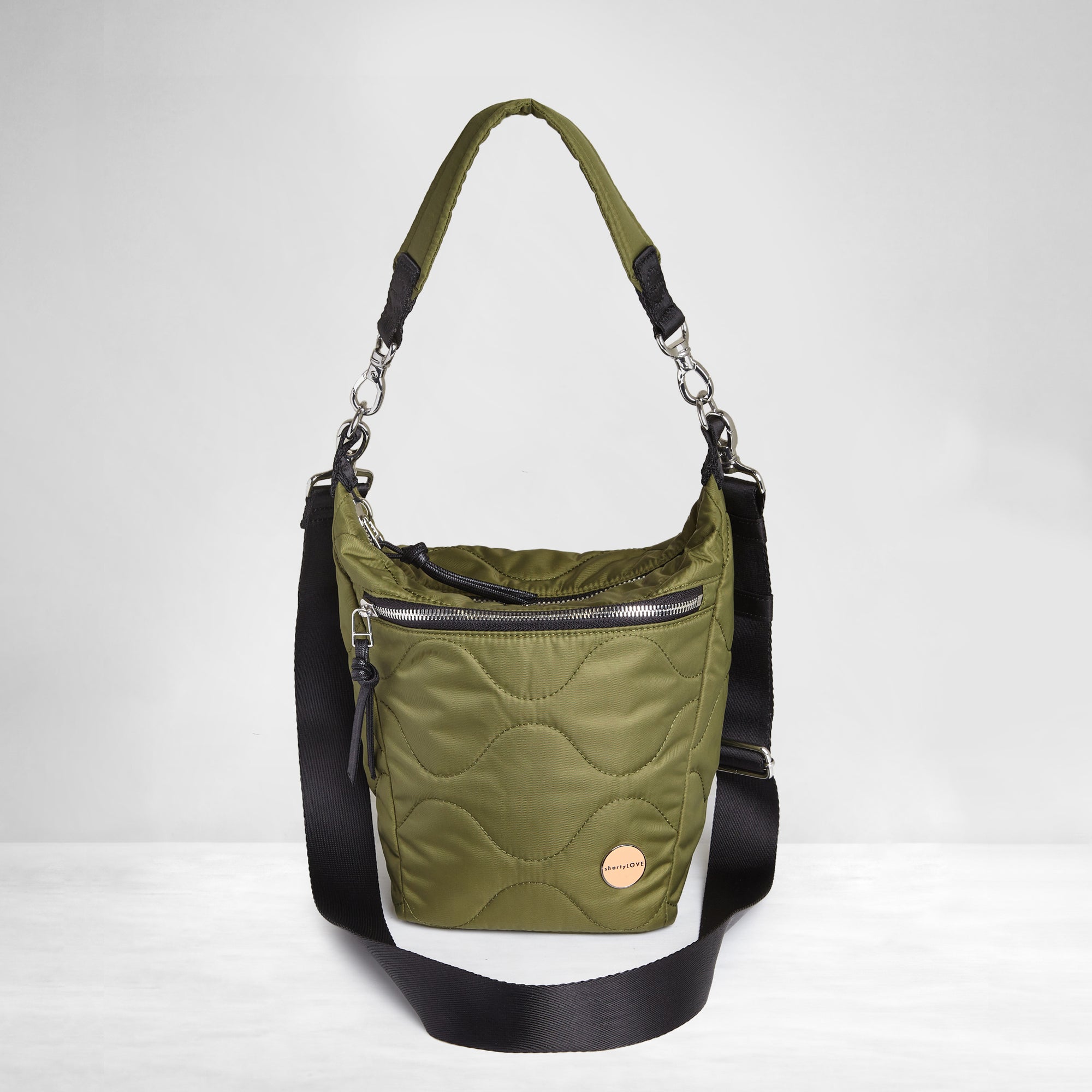 shortyLOVE marcel crossbody bucket bag in sage; front view against white background.