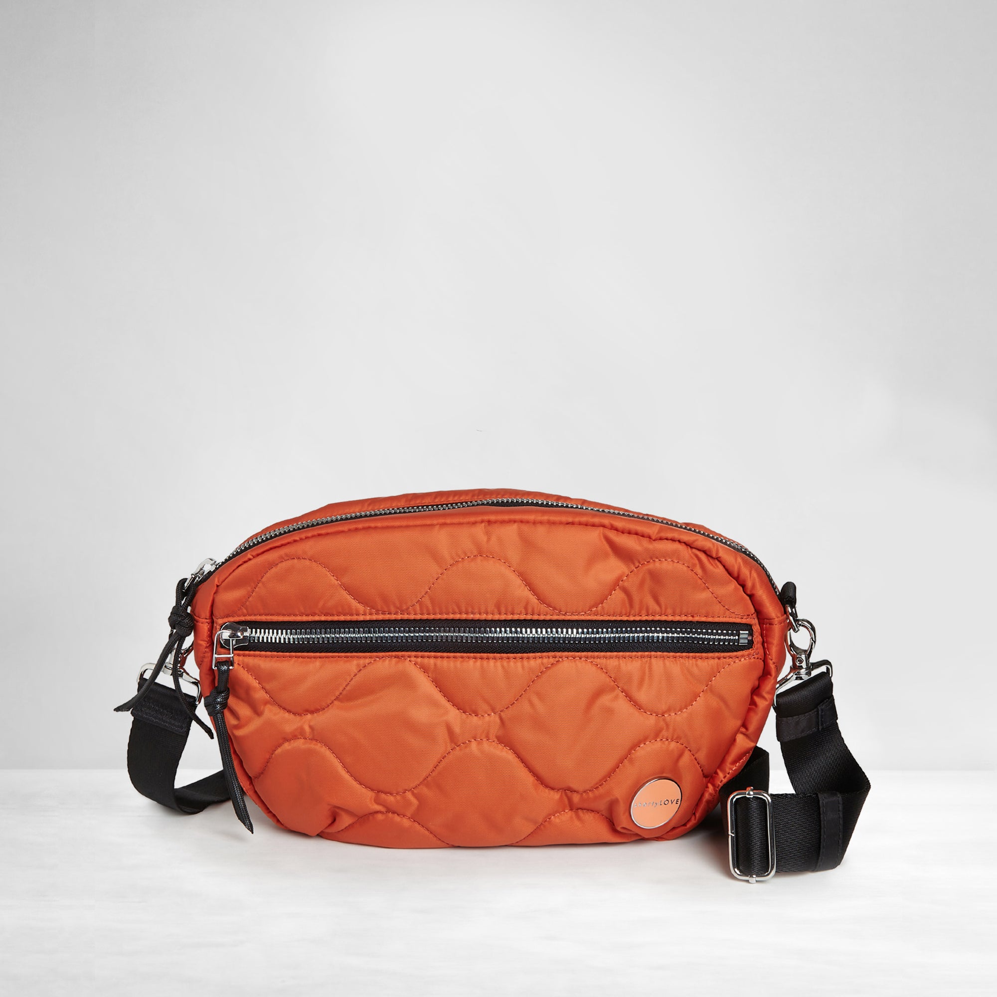 shortyLOVE cruiser medium crossbody bag in orange; front view against white background.