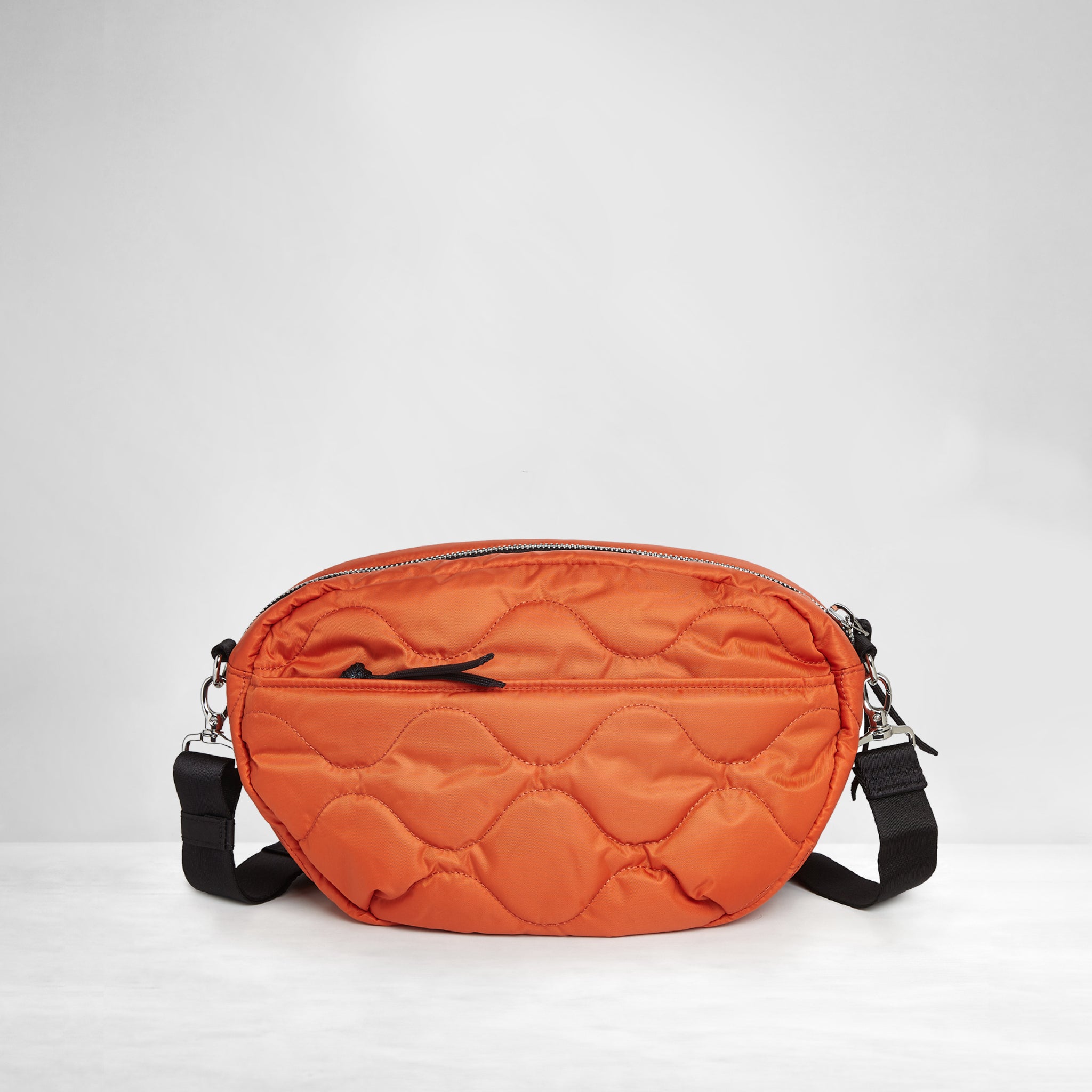 shortyLOVE cruiser medium crossbody bag in orange; back view against white background.