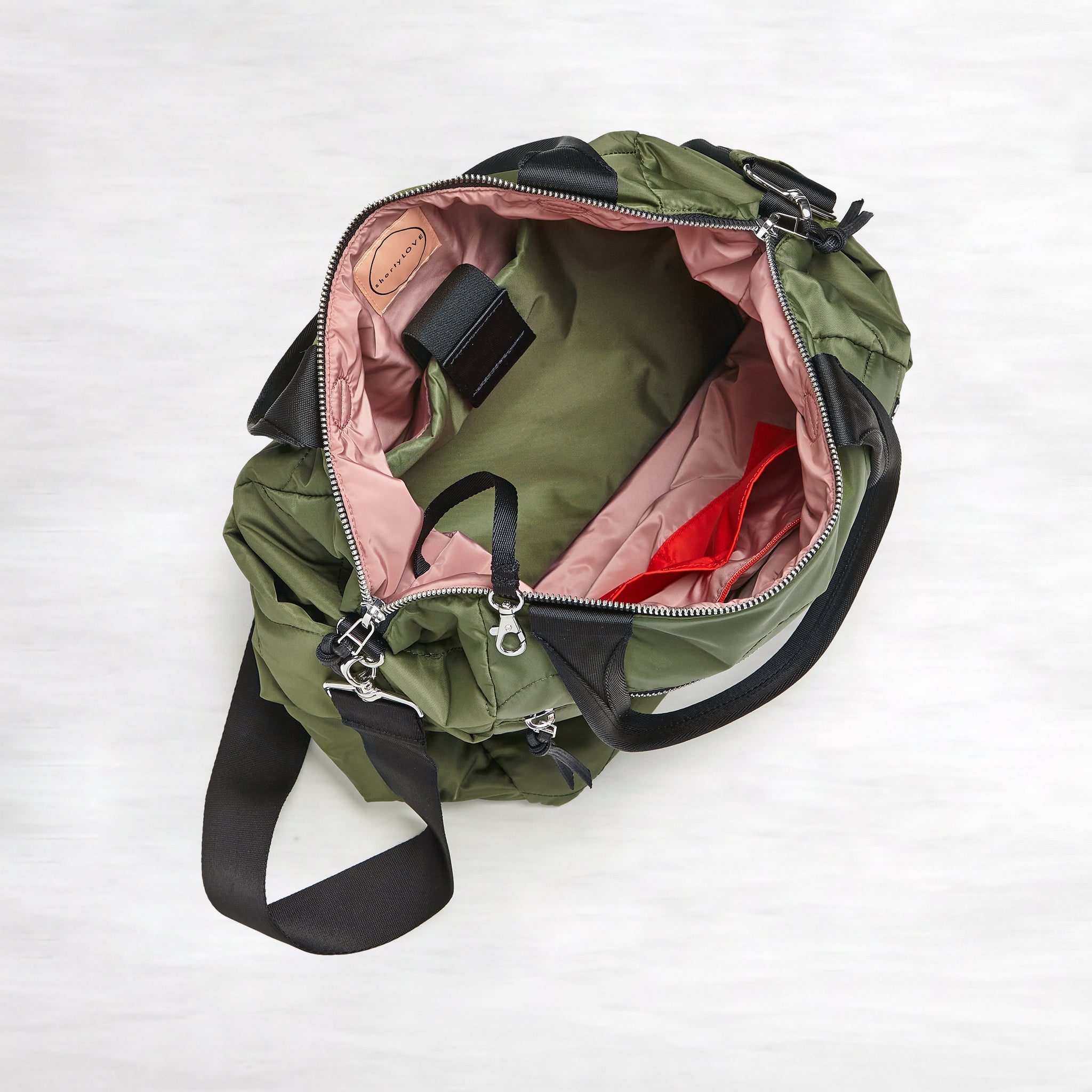 shortyLOVE ranger large tote bag in sage; top-down view showing interior blush lining against white background.