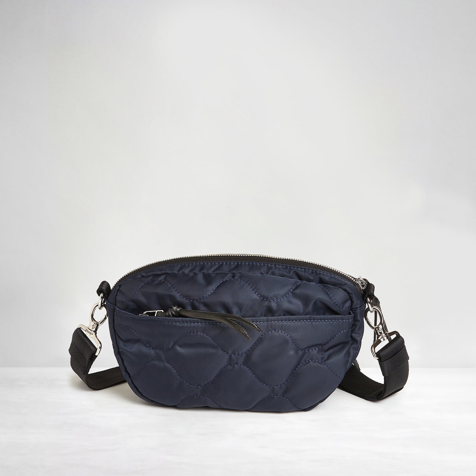 shortyLOVE small cruiser small crossbody bag in midnight; back view against white background.