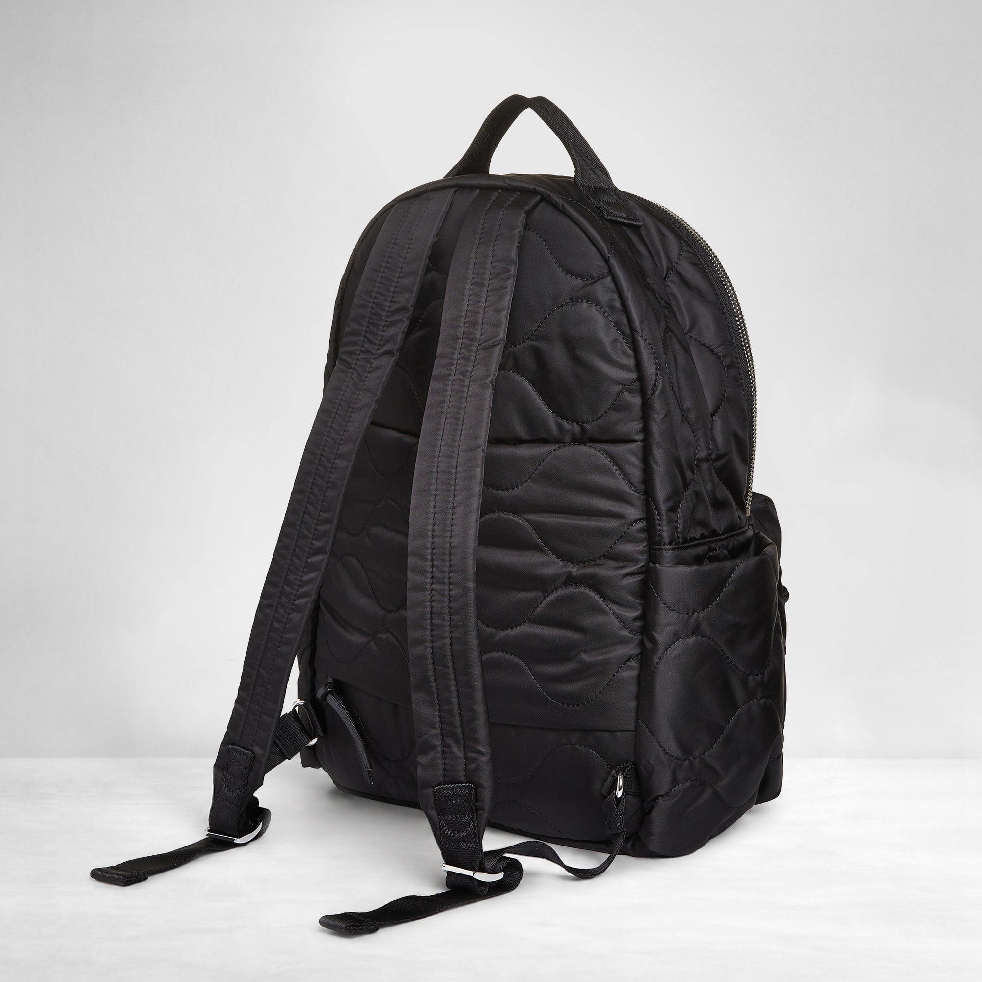 shortyLOVE tate backpack in black; back view against white background.