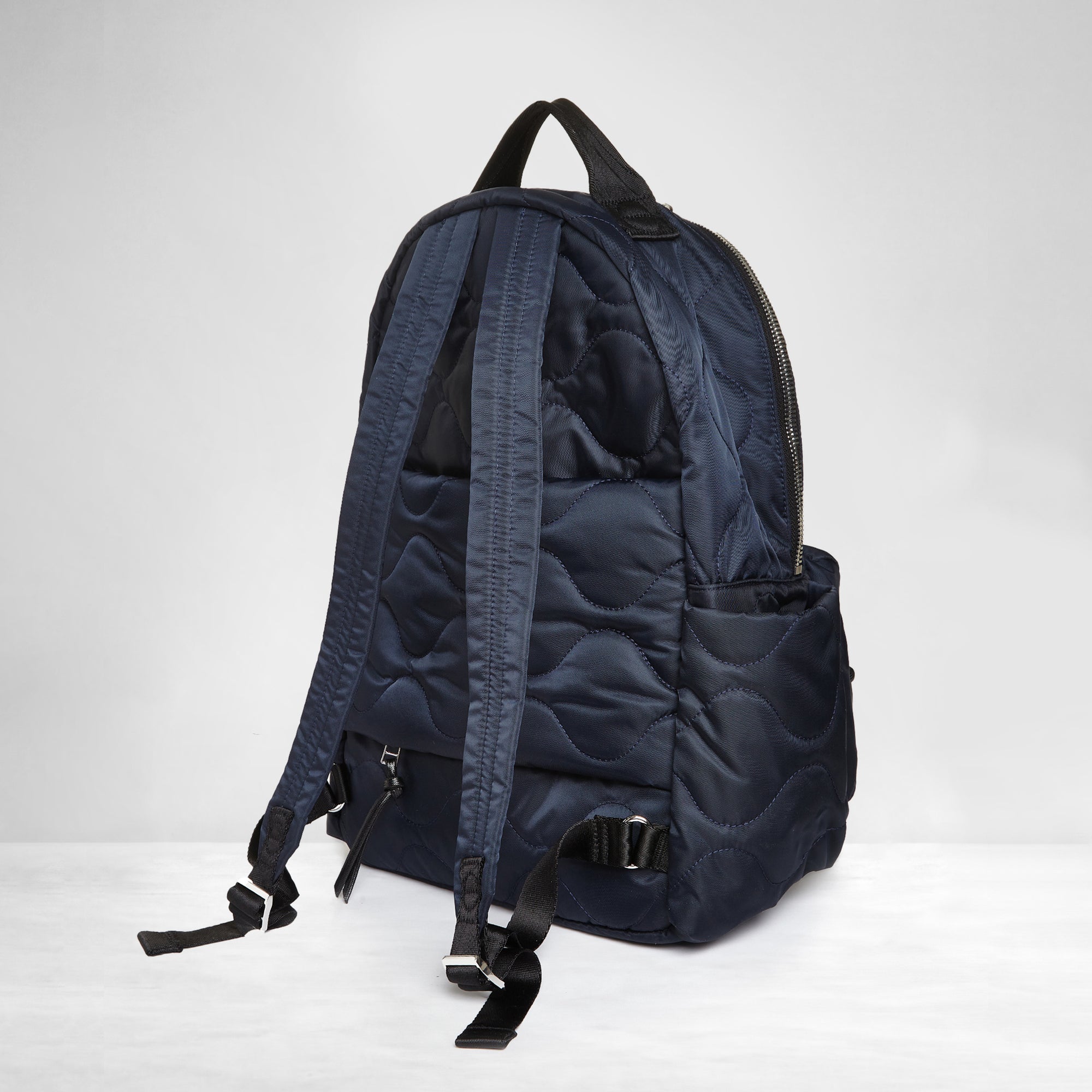 shortyLOVE tate backpack in midnight; back view against white background.