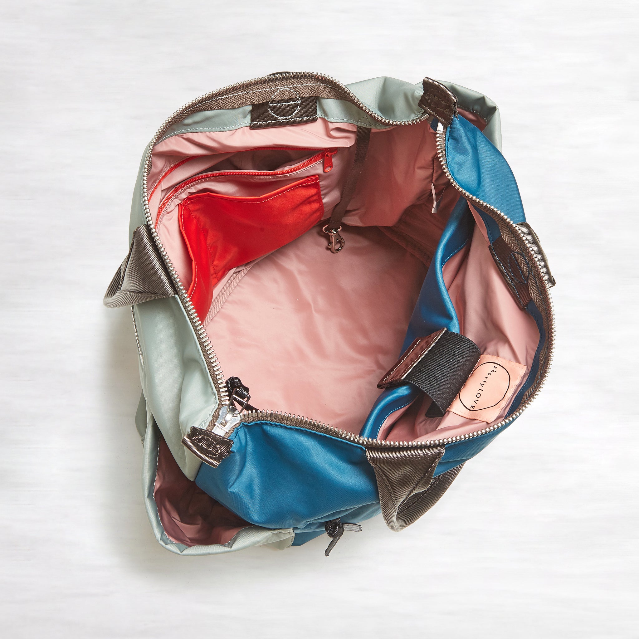 shortyLOVE tillie tote bag in slate/teal; top-down view showing interior slate/teal lining against white background.