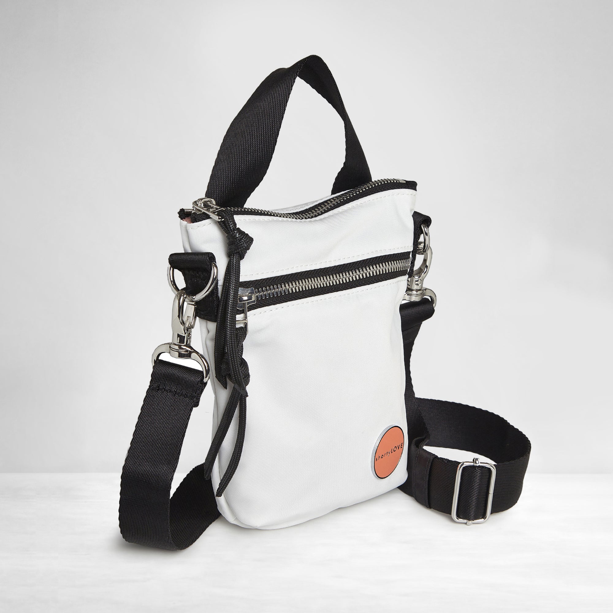 shortyLOVE shorthand crossbody phone bag in white; side angle view against white background