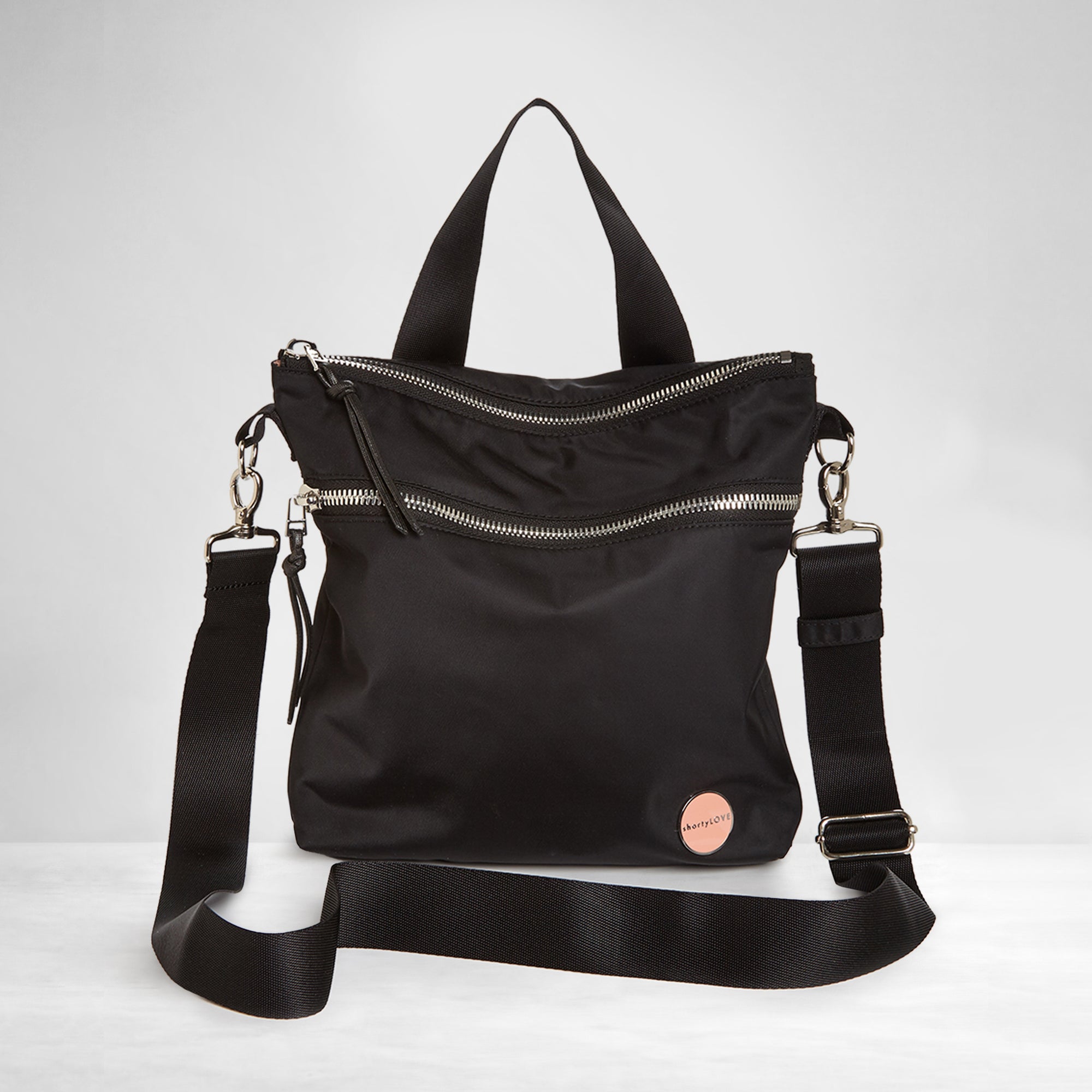 shortyLOVE amuse medium sized women’s nylon crossbody handbag in black; front view against white background