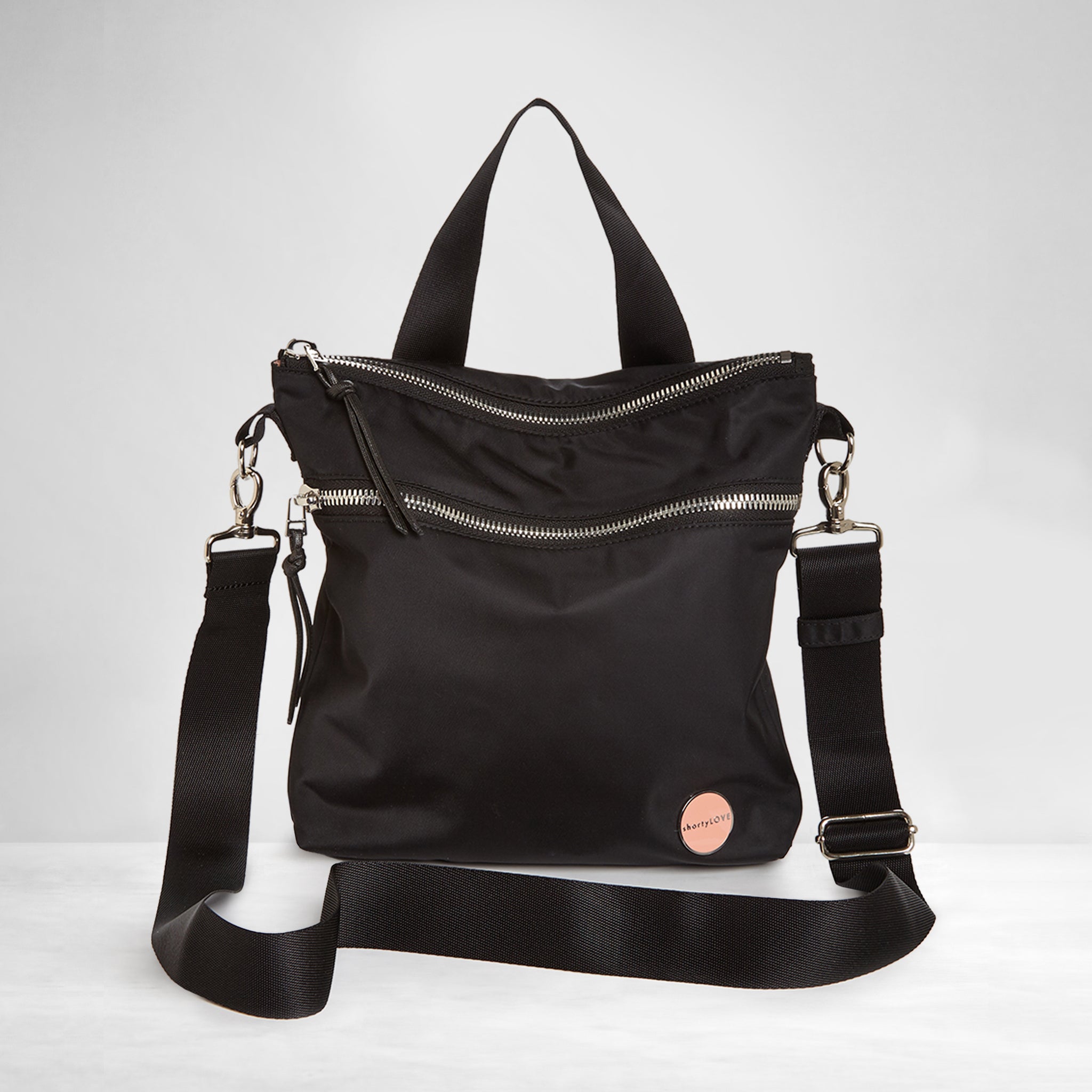 shortyLOVE amuse medium sized women’s nylon crossbody handbag in black; front view against white background