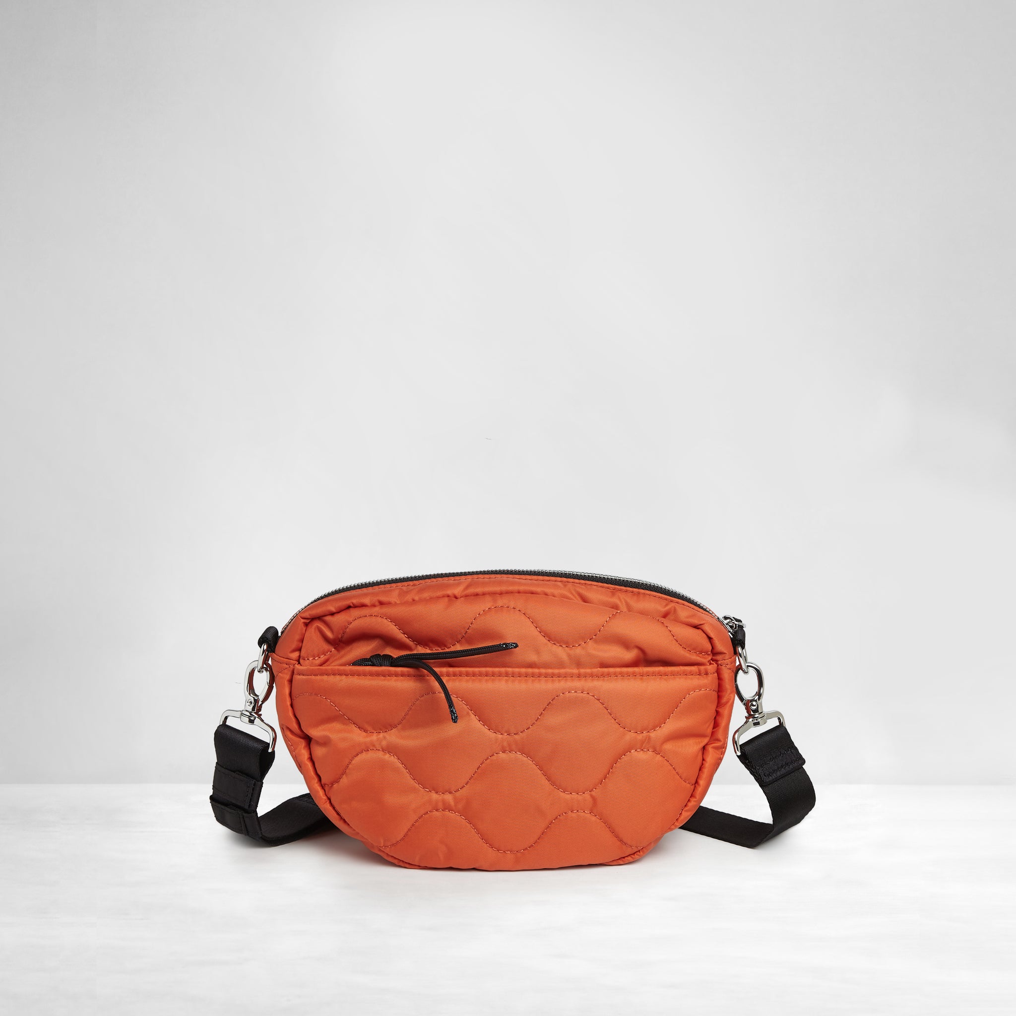 shortyLOVE small cruiser small crossbody bag in orange; back view against white background.