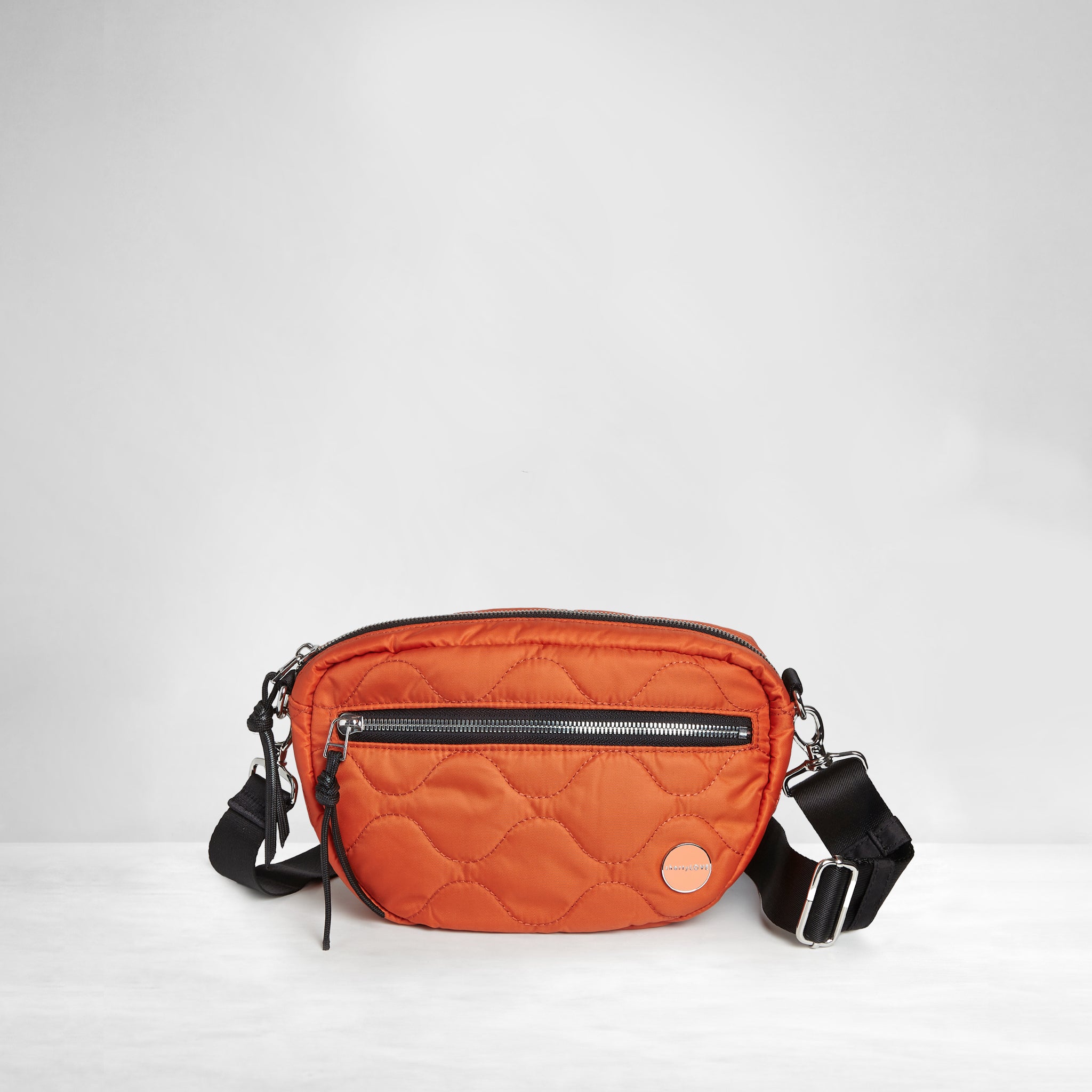 shortyLOVE small cruiser small crossbody bag in orange; front view against white background.