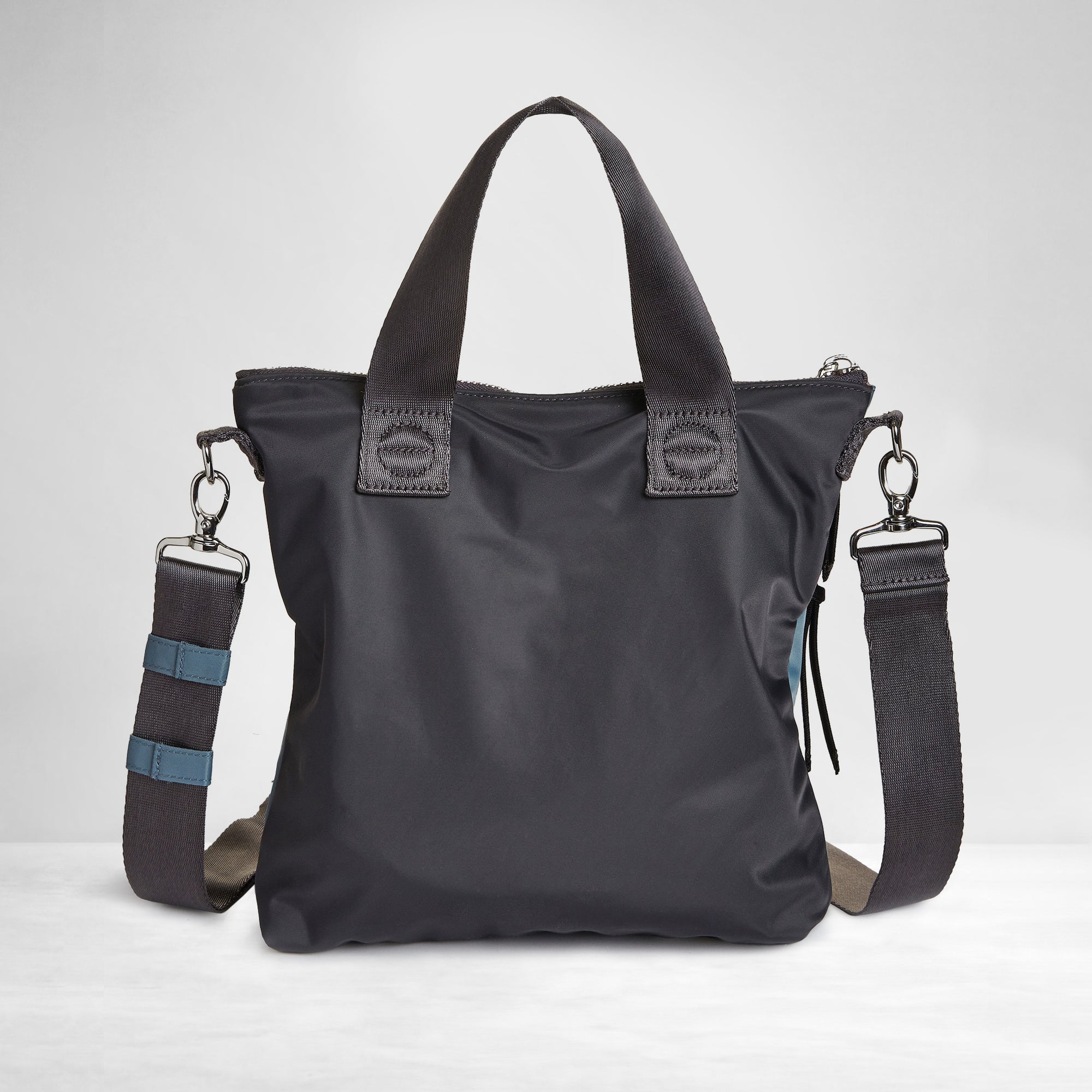 shortyLOVE amuse medium sized crossbody bag in steel blue/charcoal; back view against white background.