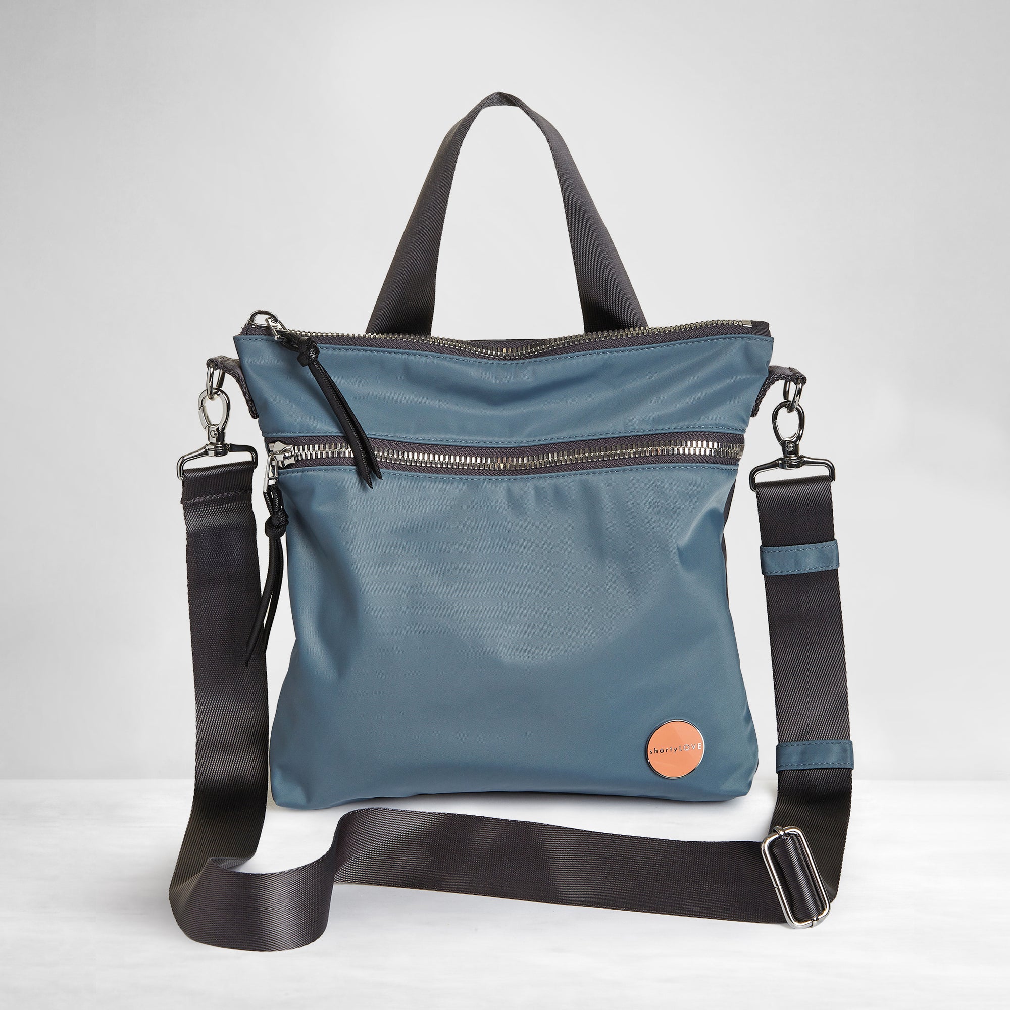 shortyLOVE amuse medium sized crossbody bag in steel blue/charcoal; front view against white background.