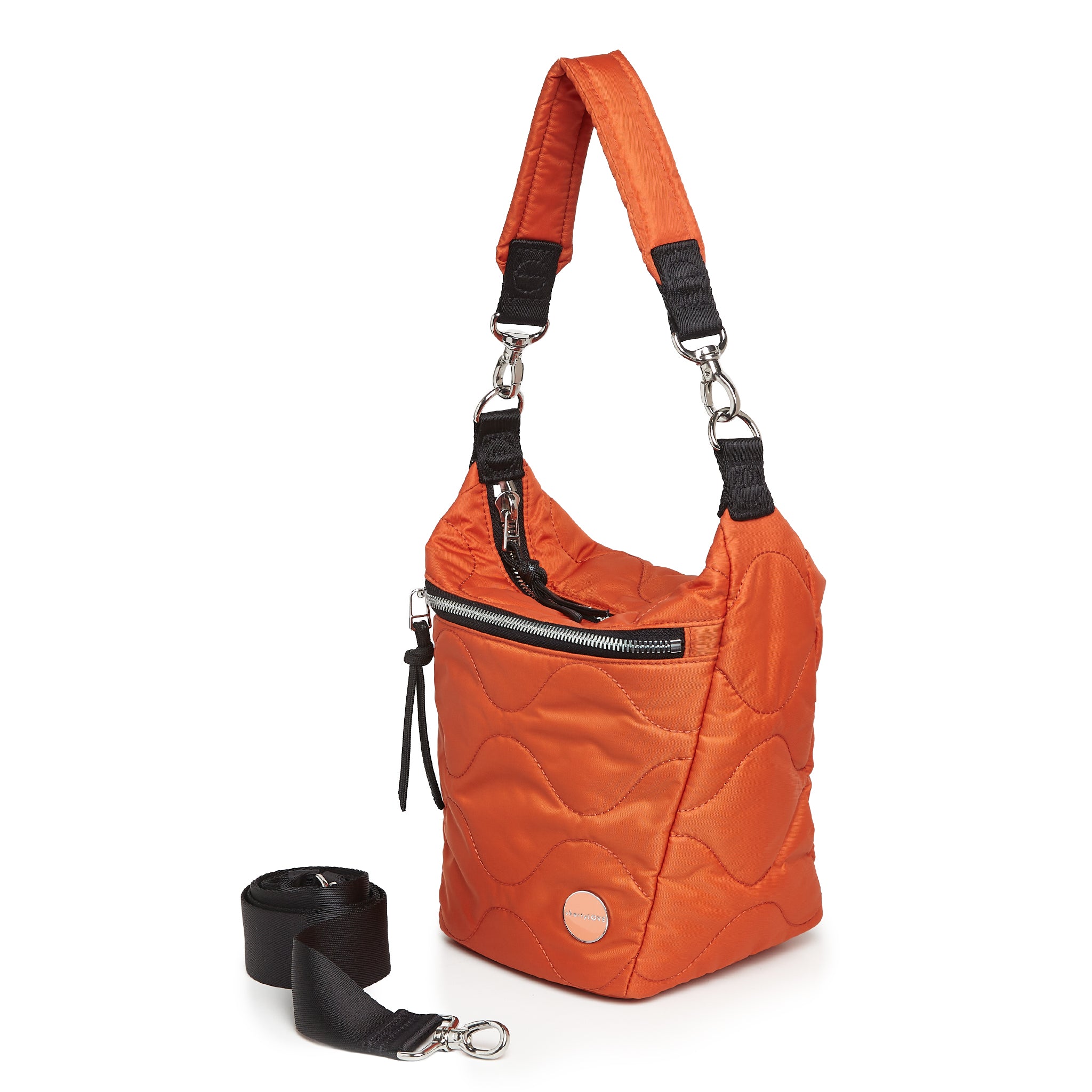 shortyLOVE marcel crossbody bucket bag in orange; side view against white background.