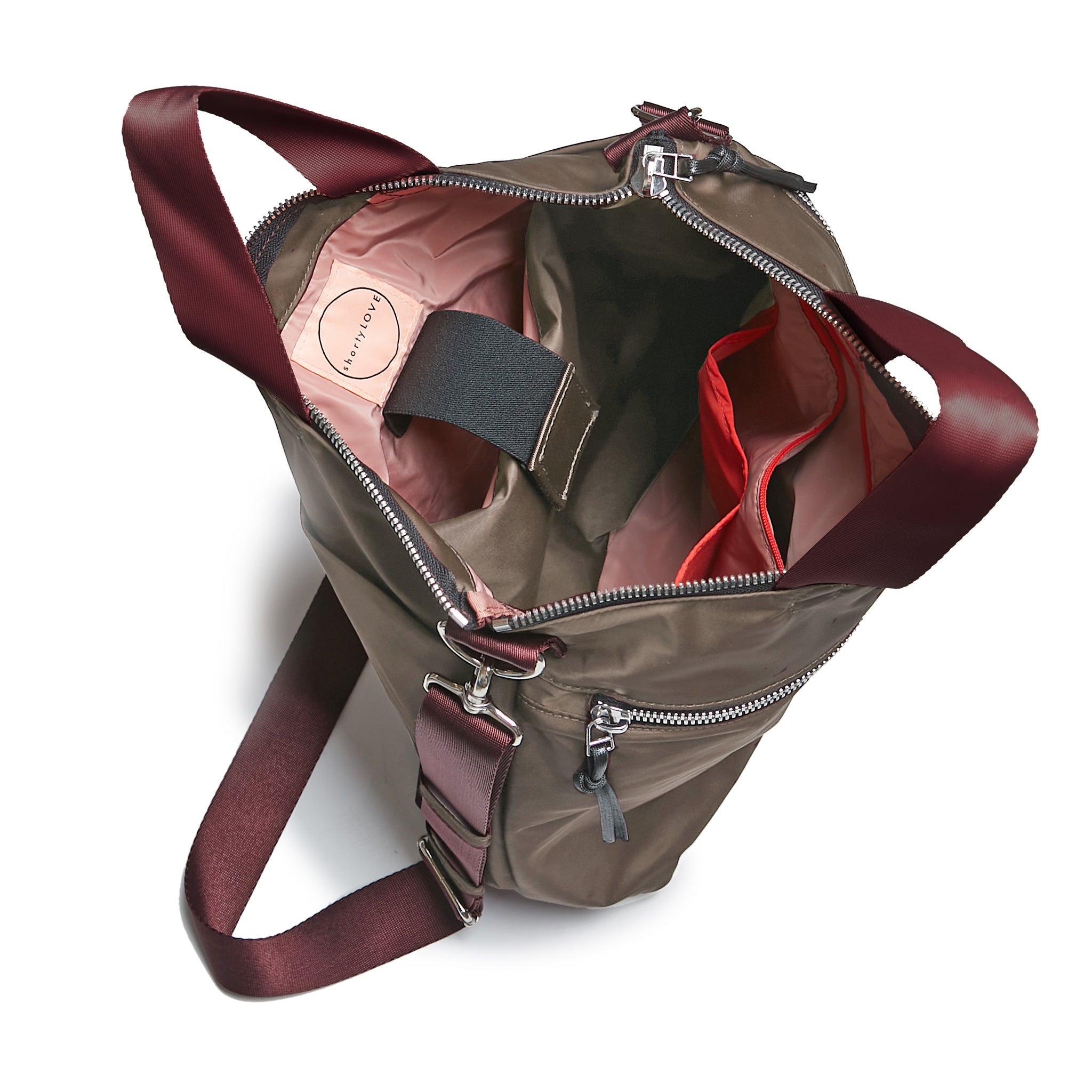 shortyLOVE wonder large crossbody/messenger bag in mocha; top-down view showing interior mocha lining against white background.