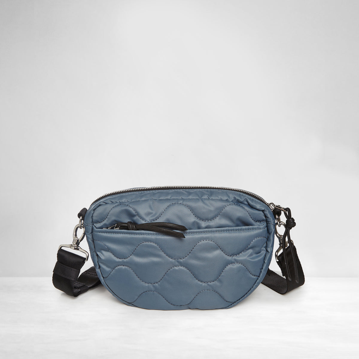 shortyLOVE cruiser medium crossbody bag in steel blue; back view against white background.