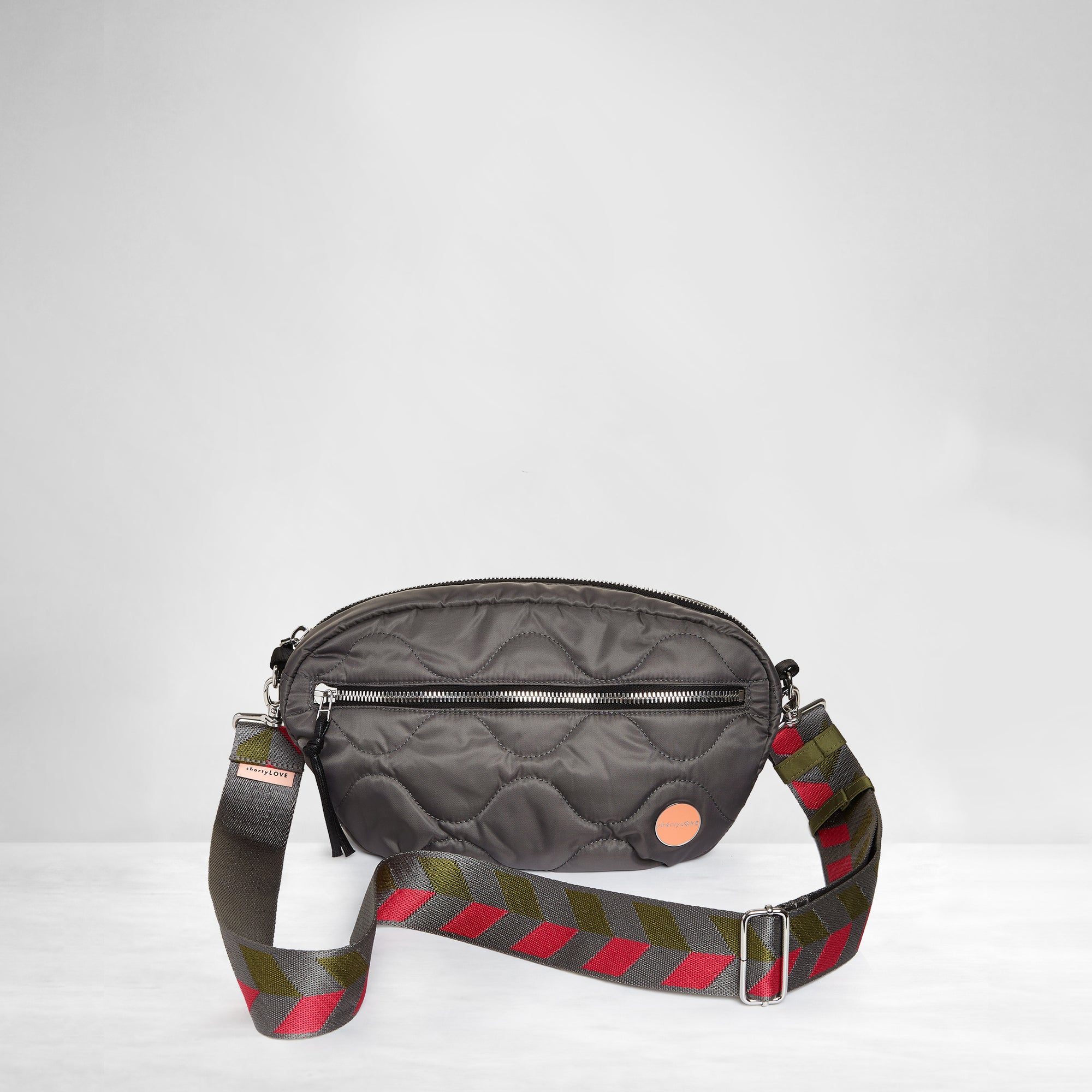 shortyLOVE boardwalk strap in arrow design in pewter/sage/magenta; shown with small cruiser bag in pewter.