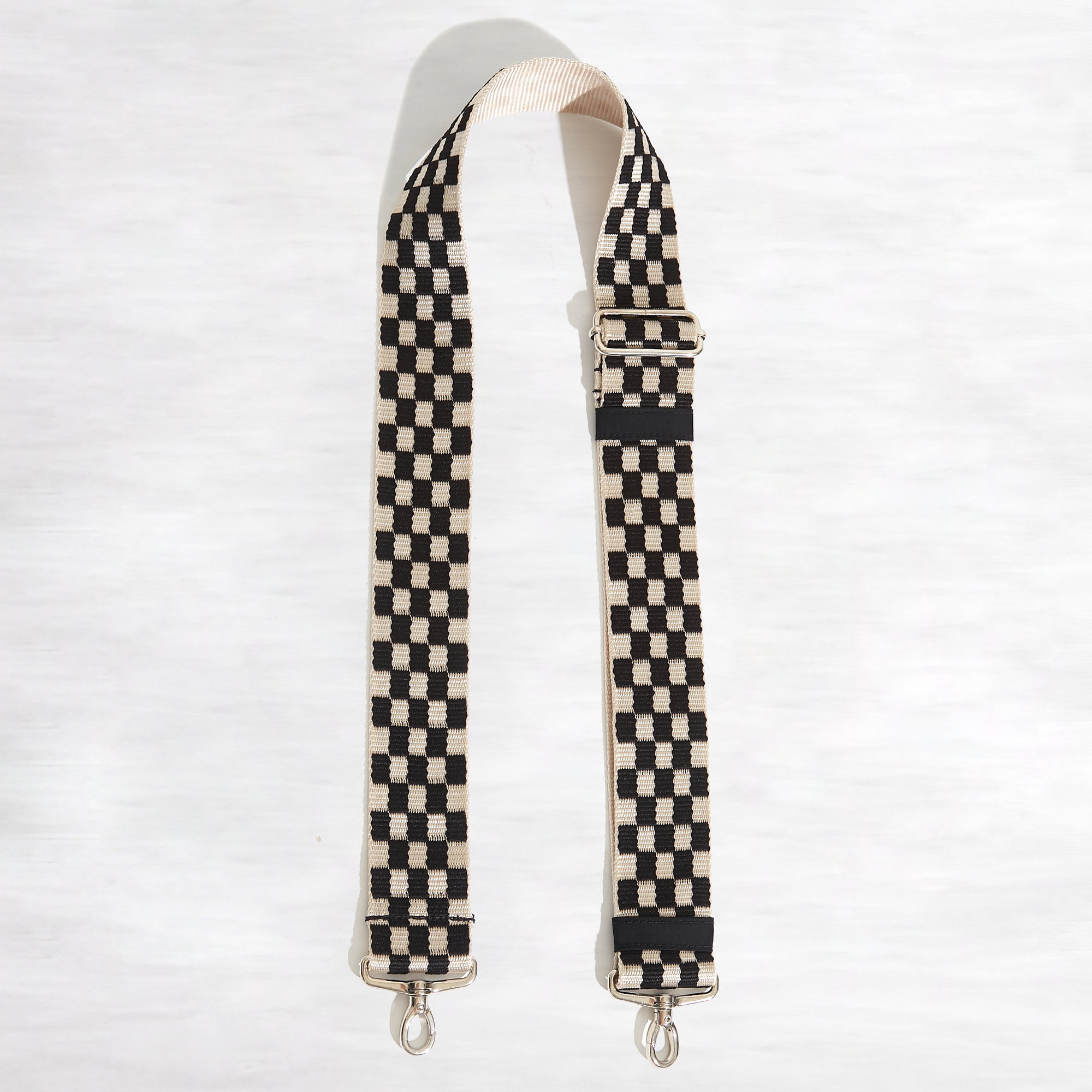 shortyLOVE boardwalk strap in black/white checker; top view open against white background.