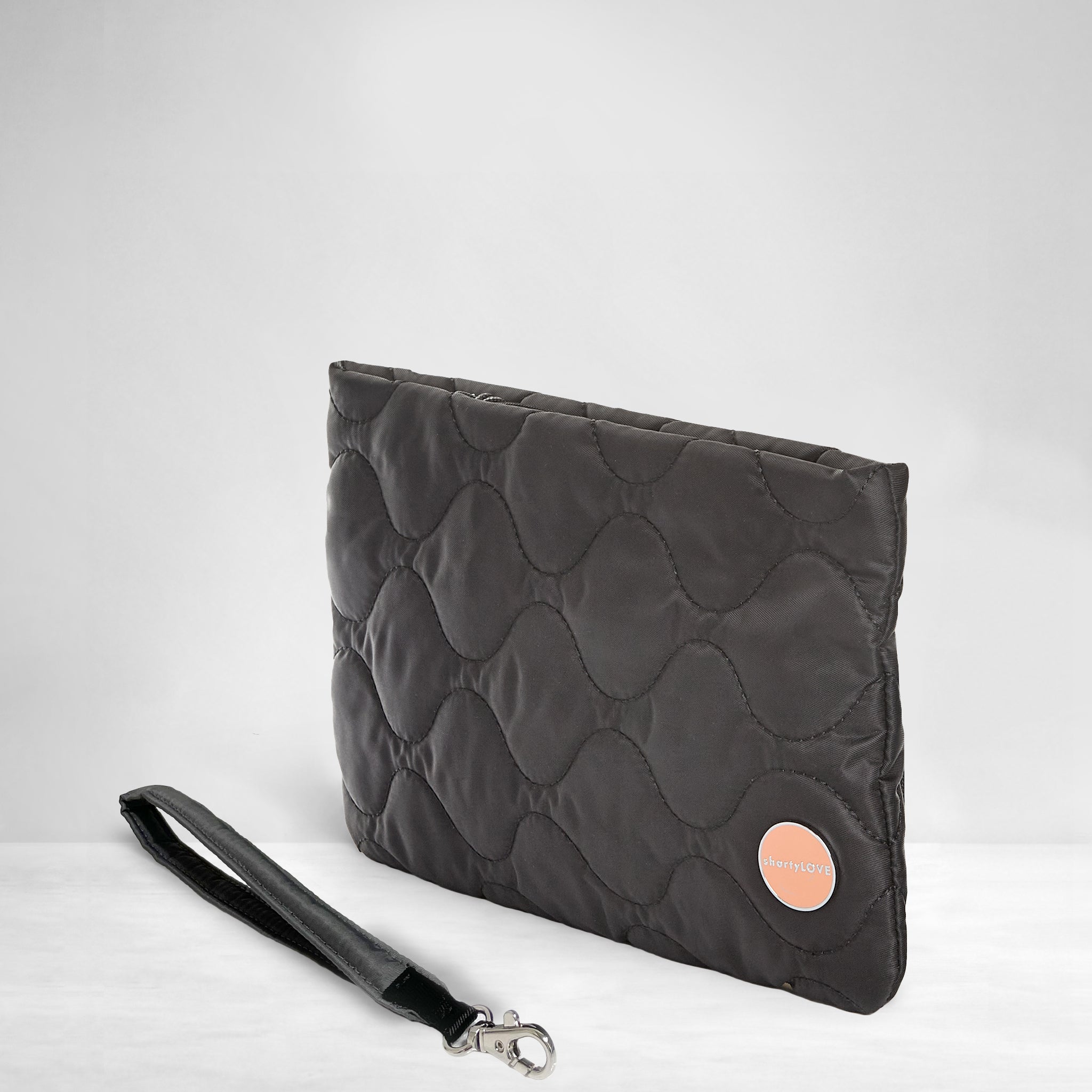 shortyLOVE cleo wristlet clutch in black; side view against white background.
