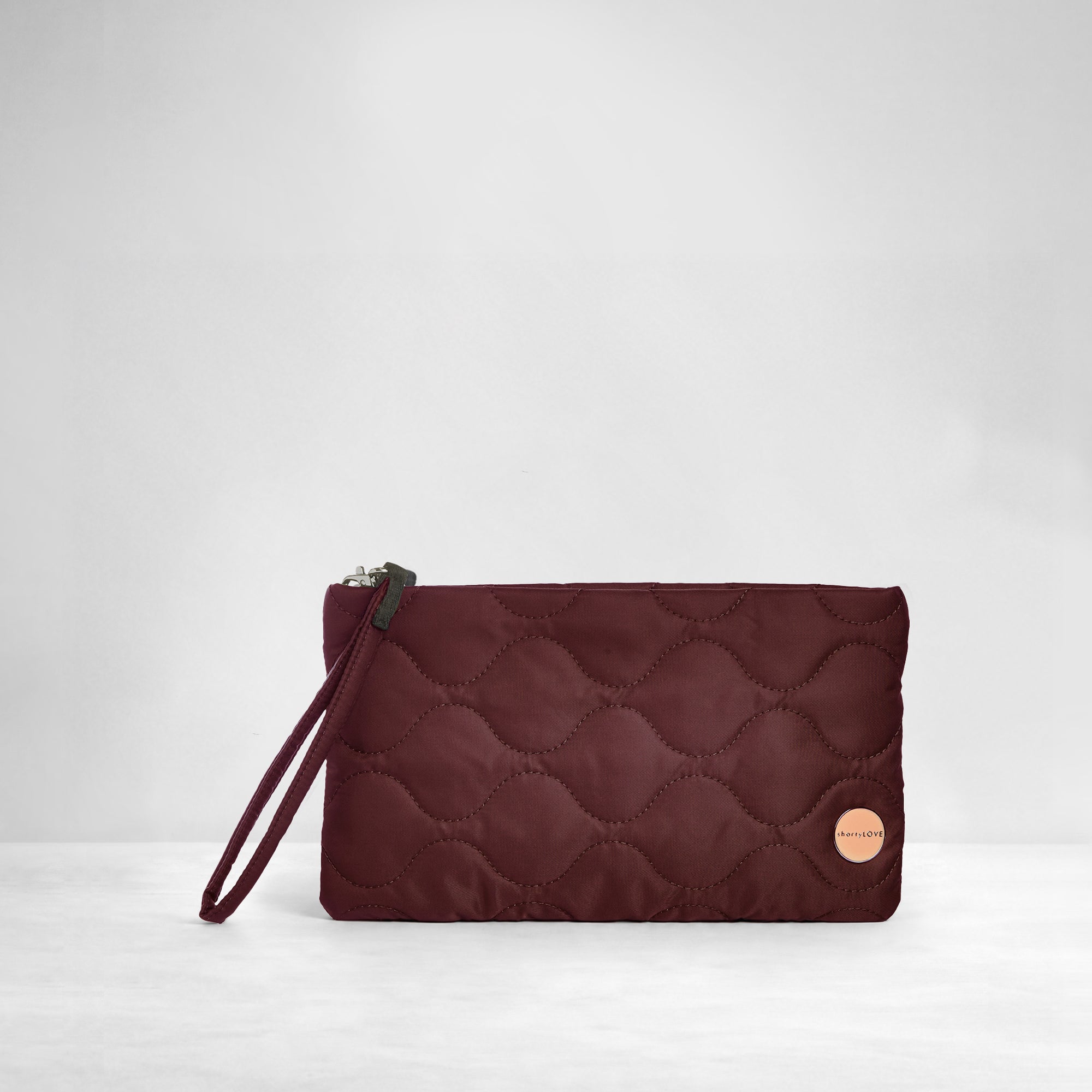shortyLOVE cleo wristlet clutch in bordeaux; front view against white background.
