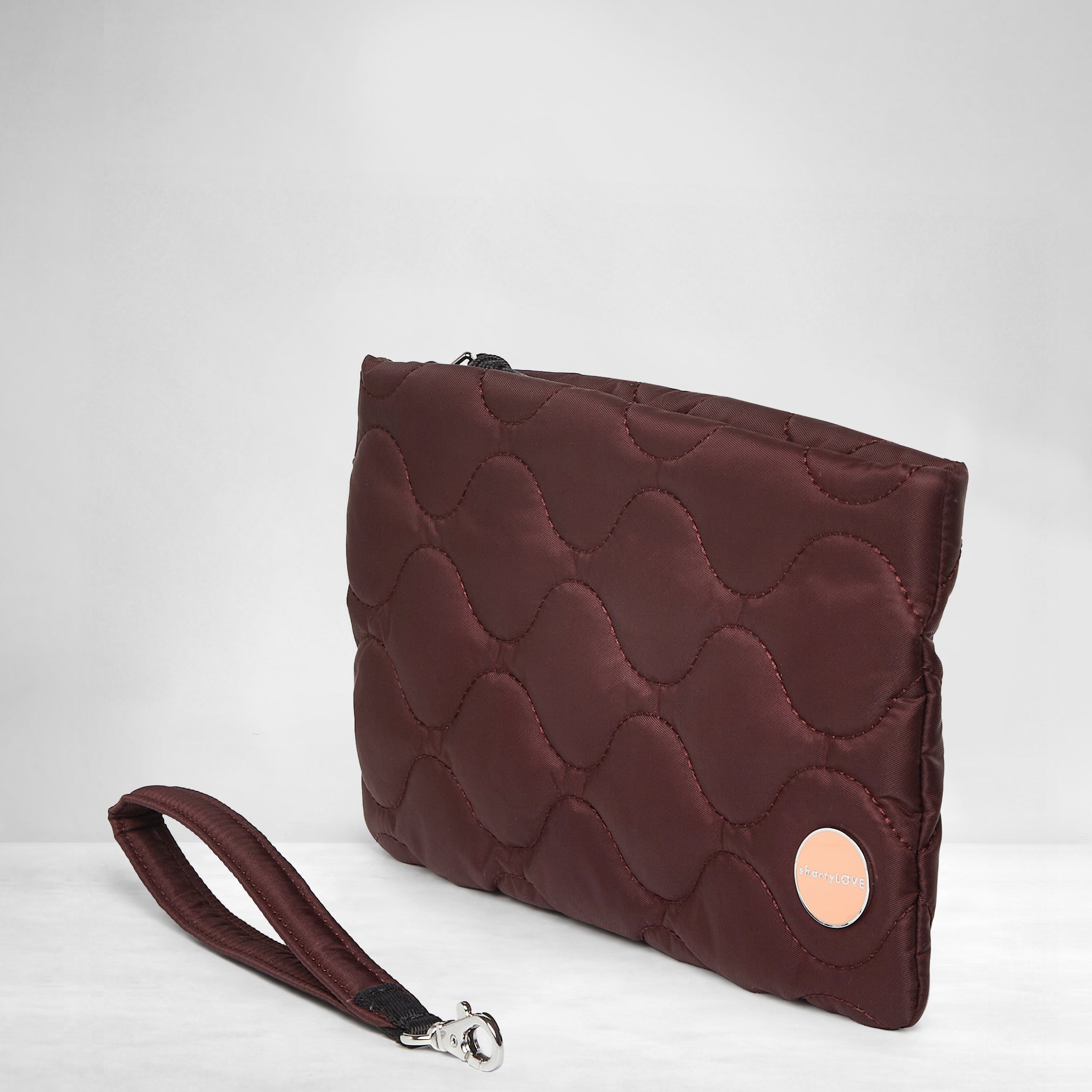 shortyLOVE cleo wristlet clutch in bordeaux; side view against white background.