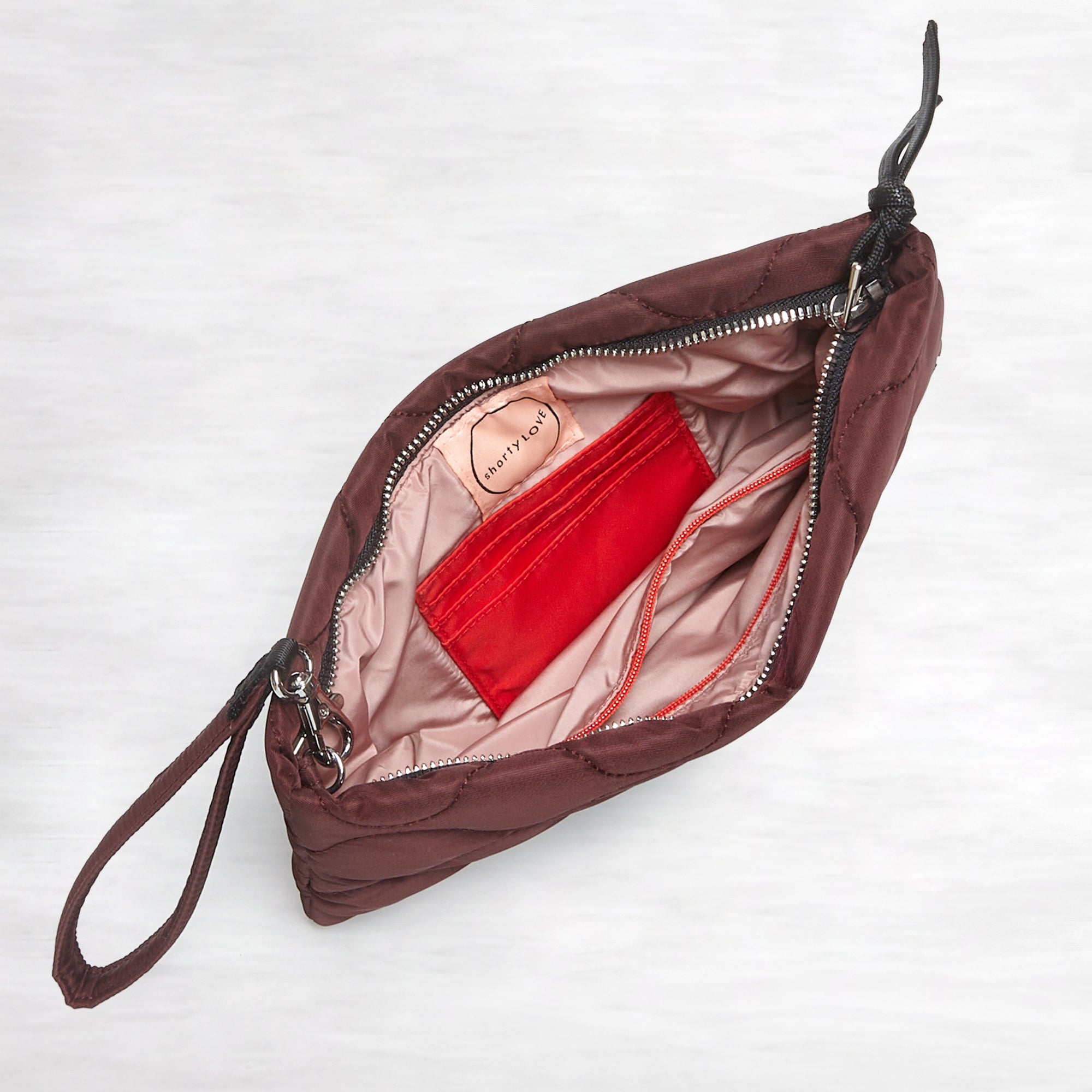 shortyLOVE cleo wristlet clutch in bordeaux; top down open view against white background.