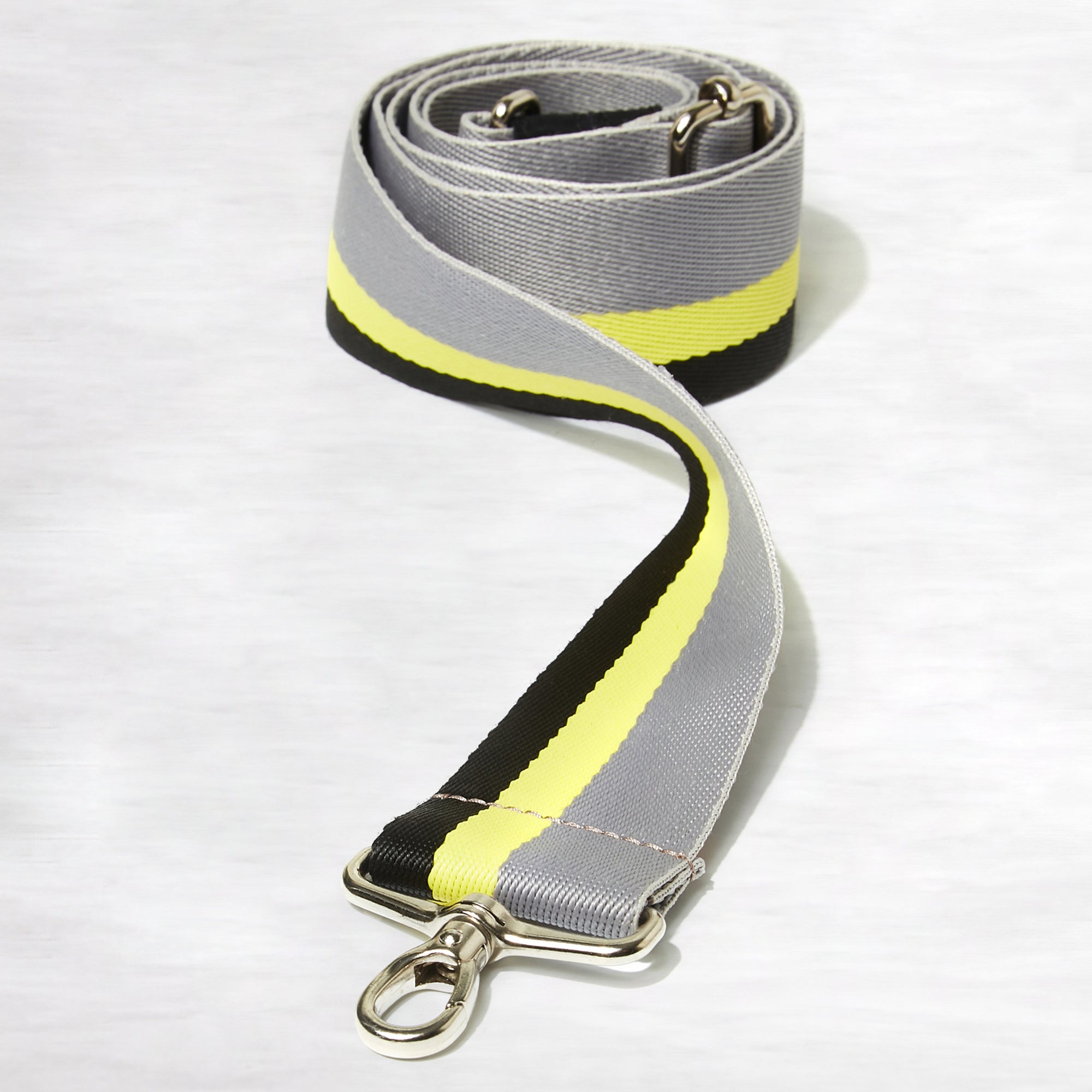 shortyLOVE boardwalk strap in grey/yellow/black; coiled close up view against white background.
