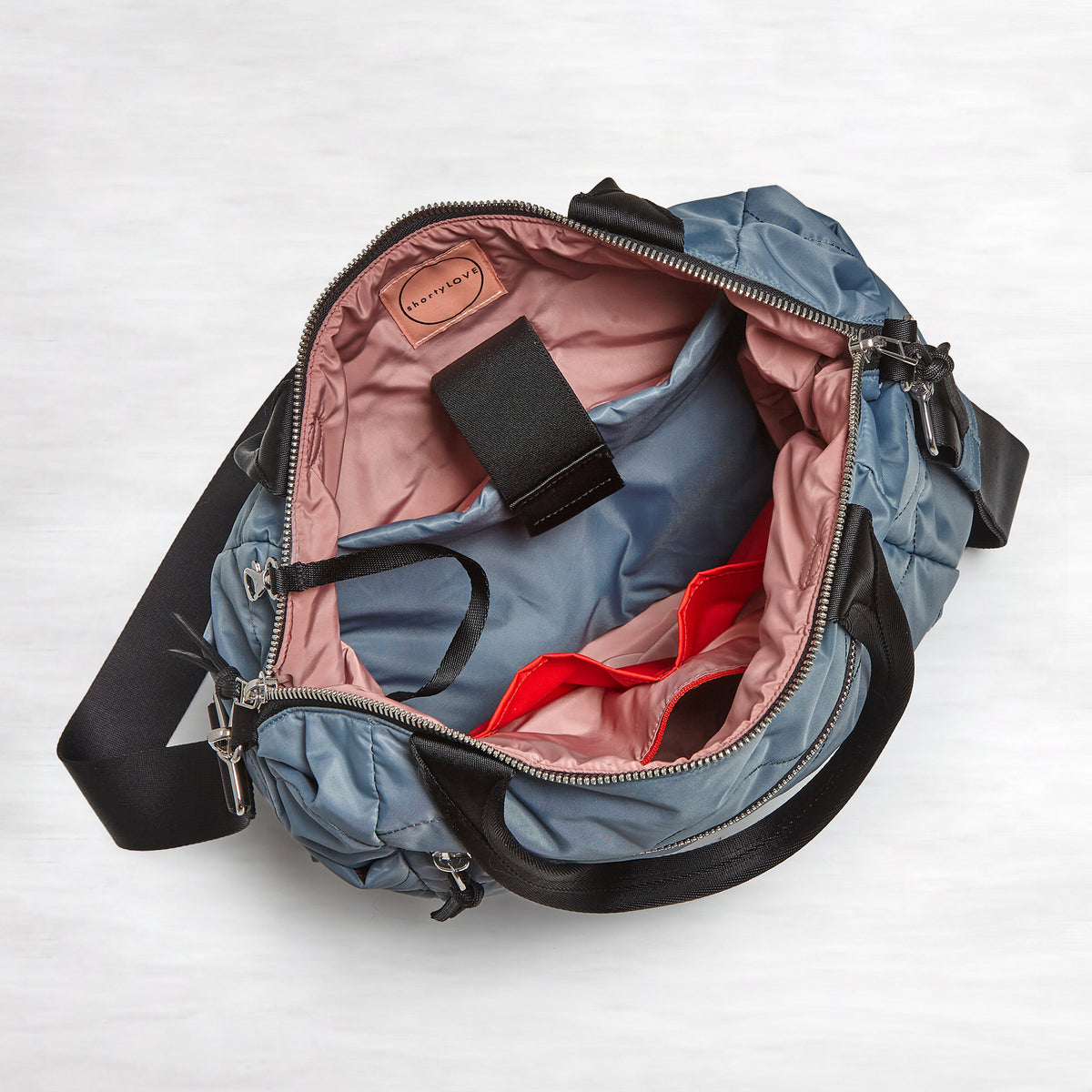 shortyLOVE ranger large tote bag in steel blue; top-down view showing interior blush lining against white background.