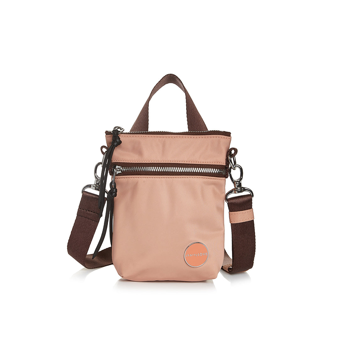 shortyLOVE shorthand small crossbody bag in dusty peach; front view against white background.