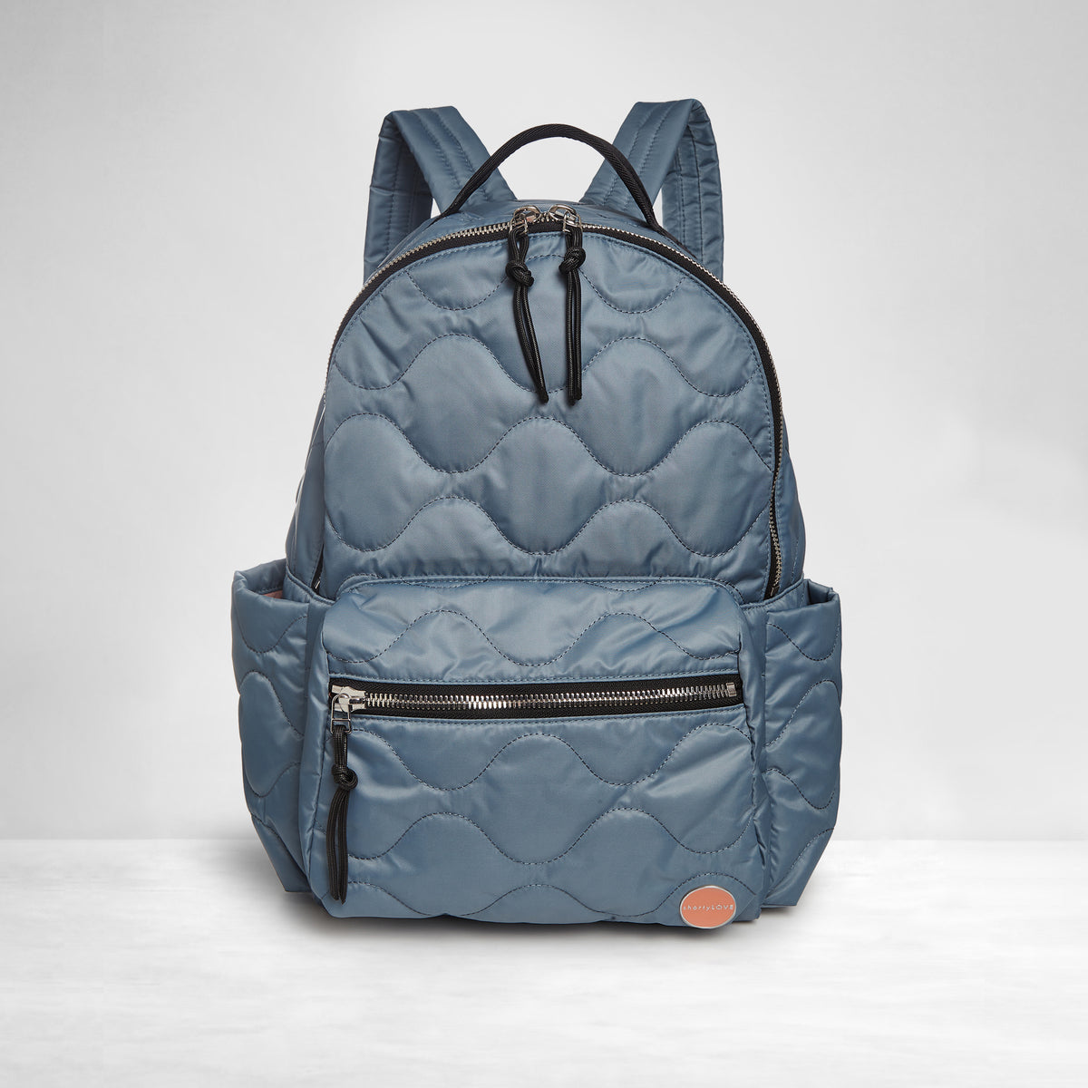 shortyLOVE tate backpack in steel blue; front view against white background.