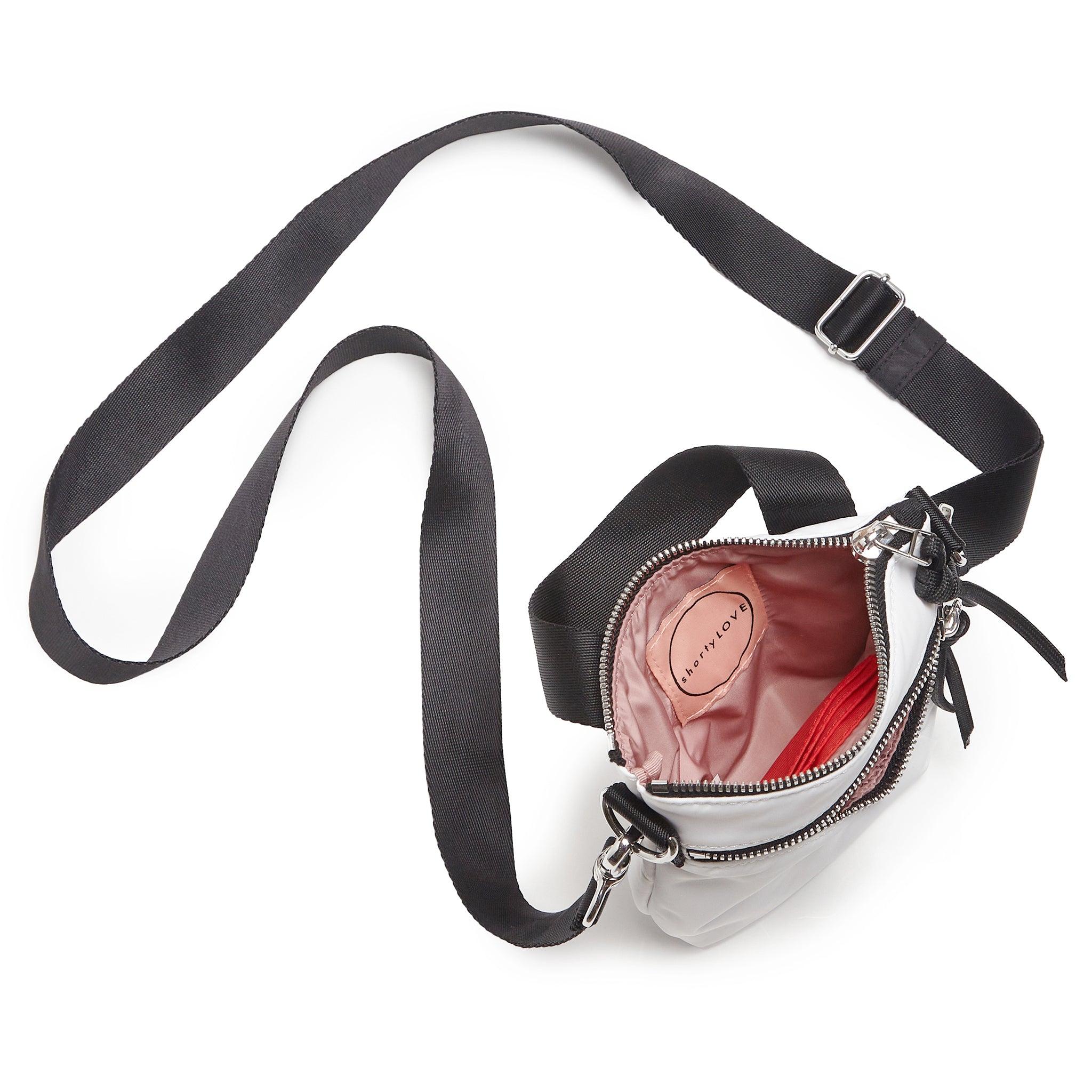 shortyLOVE shorthand small crossbody bag in white; top-down view showing interior blush/red lining against white background.
