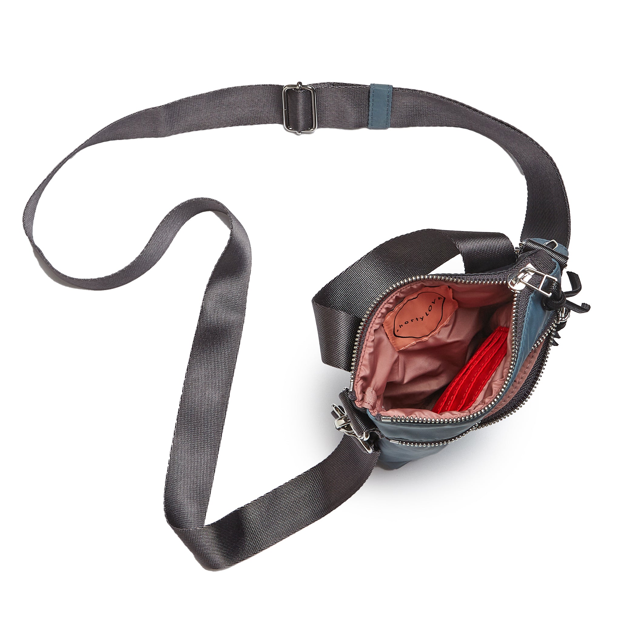 shortyLOVE shorthand small crossbody bag in steel blue/charcoal; top-down view showing interior steel blue/charcoal lining against white background.